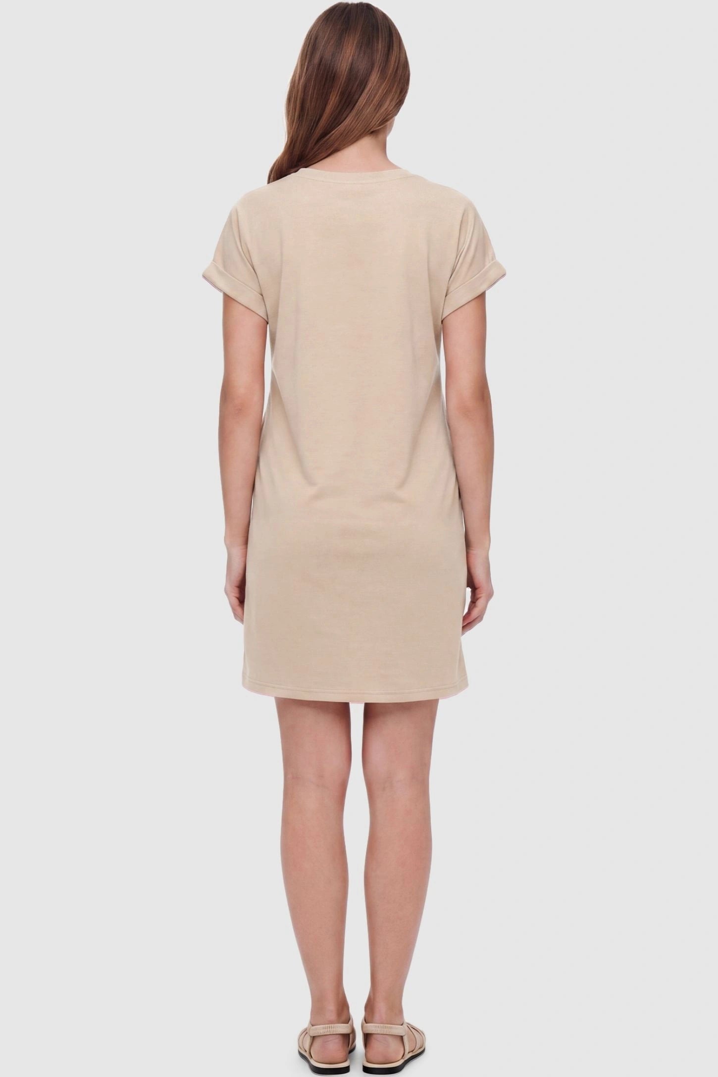 Flowy Pocket Tunic Maternity T-Shirt Dress Flowy Pocket Tunic Maternity T-Shirt Dress in Beige featuring a classic crew neckline on a back-view model.