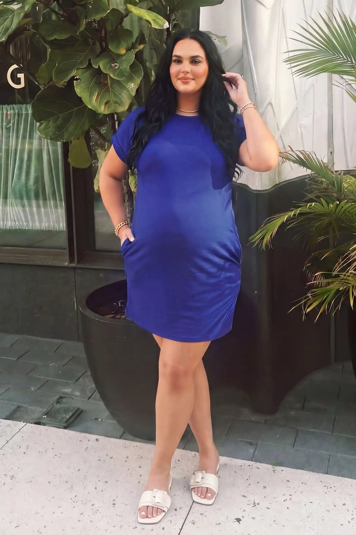 Flowy Pocket Tunic Maternity T-Shirt Dress in Blue featuring a relaxed fit on a front-view pregnant model.
