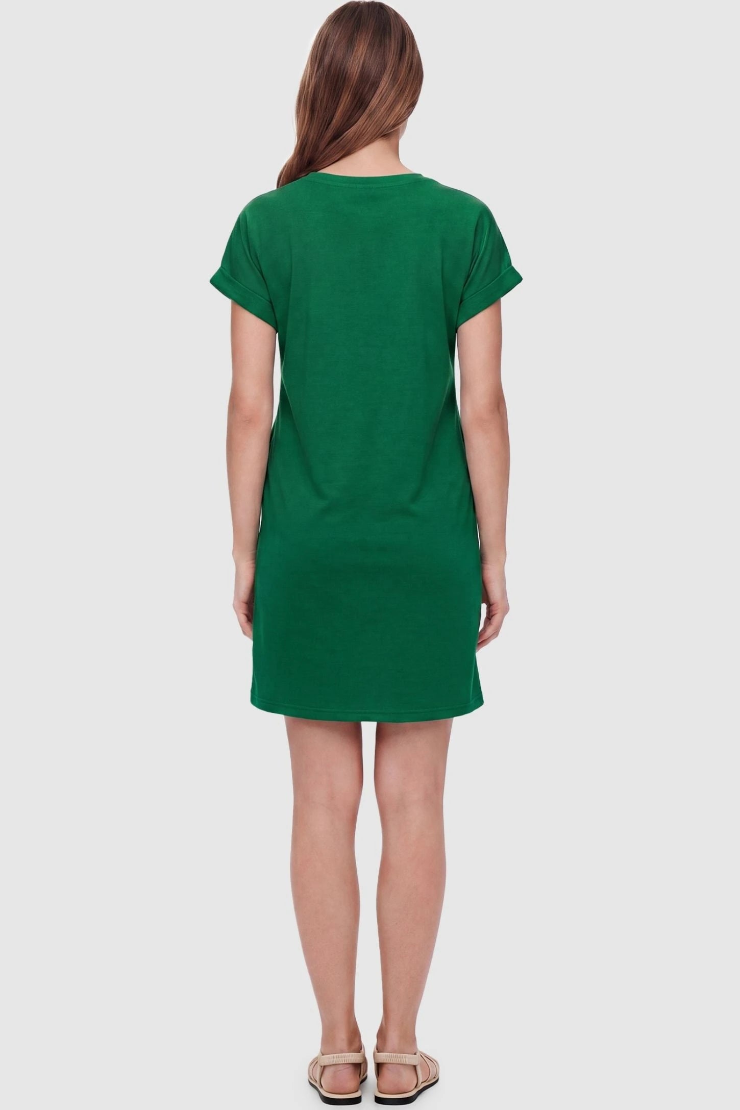 Flowy Pocket Tunic Maternity T-Shirt Dress Flowy Pocket Tunic Maternity T-Shirt Dress in Green featuring a classic crew neckline on a back-view model.