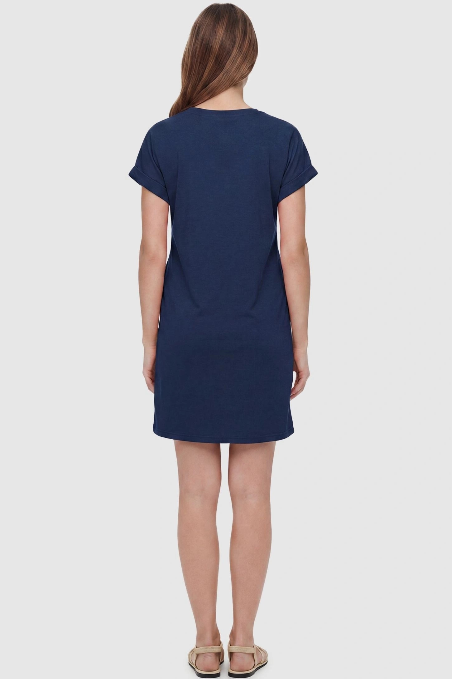 Flowy Pocket Tunic Maternity T-Shirt Dress Flowy Pocket Tunic Maternity T-Shirt Dress in Navy Blue featuring a classic crew neckline on a back-view model.
