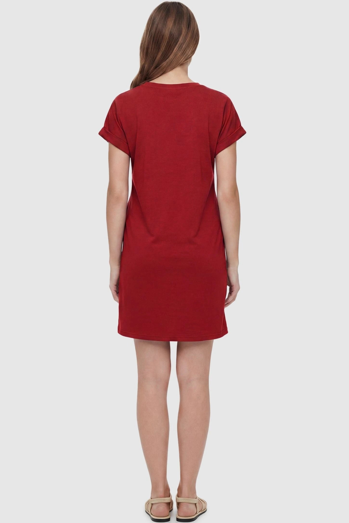 Flowy Pocket Tunic Maternity T-Shirt Dress Flowy Pocket Tunic Maternity T-Shirt Dress in Red featuring a classic crew neckline on a back-view model.