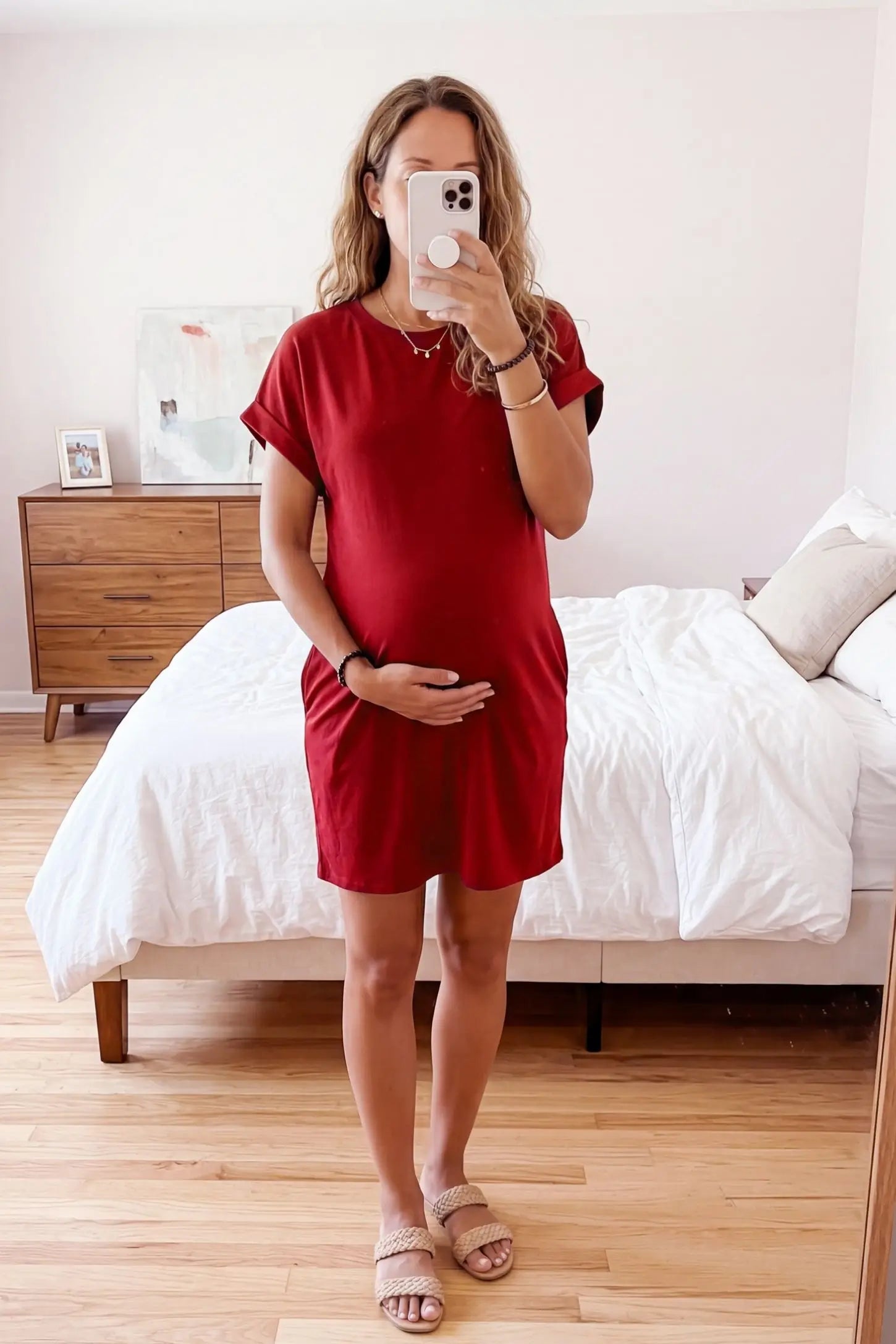 Flowy Pocket Tunic Maternity T-Shirt Dress Flowy Pocket Tunic Maternity T-Shirt Dress in Red featuring a relaxed fit on a front-view pregnant model.