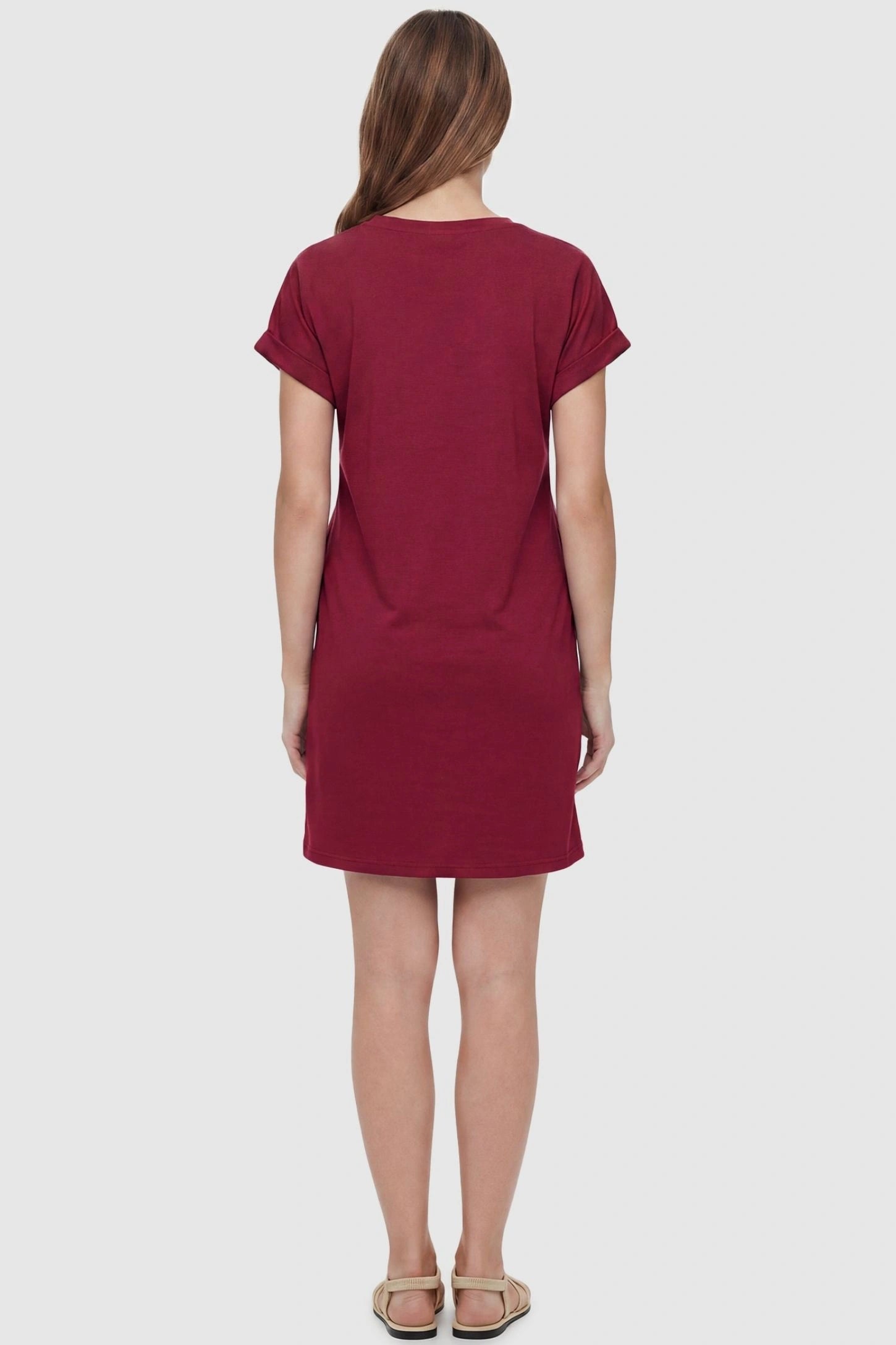 Flowy Pocket Tunic Maternity T-Shirt Dress Flowy Pocket Tunic Maternity T-Shirt Dress in Wine Red featuring a classic crew neckline on a back-view model.