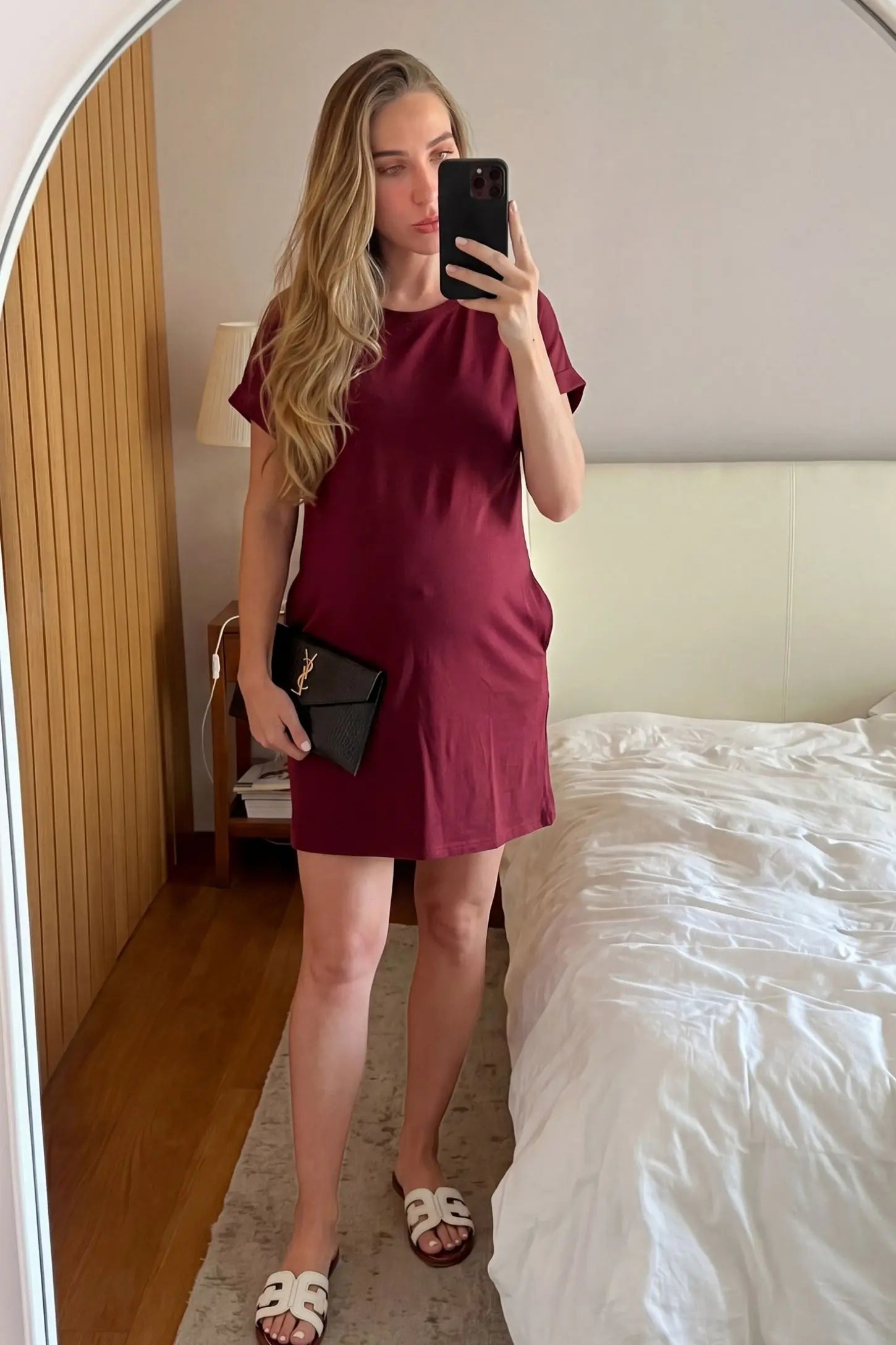 Flowy Pocket Tunic Maternity T-Shirt Dress Flowy Pocket Tunic Maternity T-Shirt Dress in Wine Red featuring a relaxed fit on a front-view pregnant model.