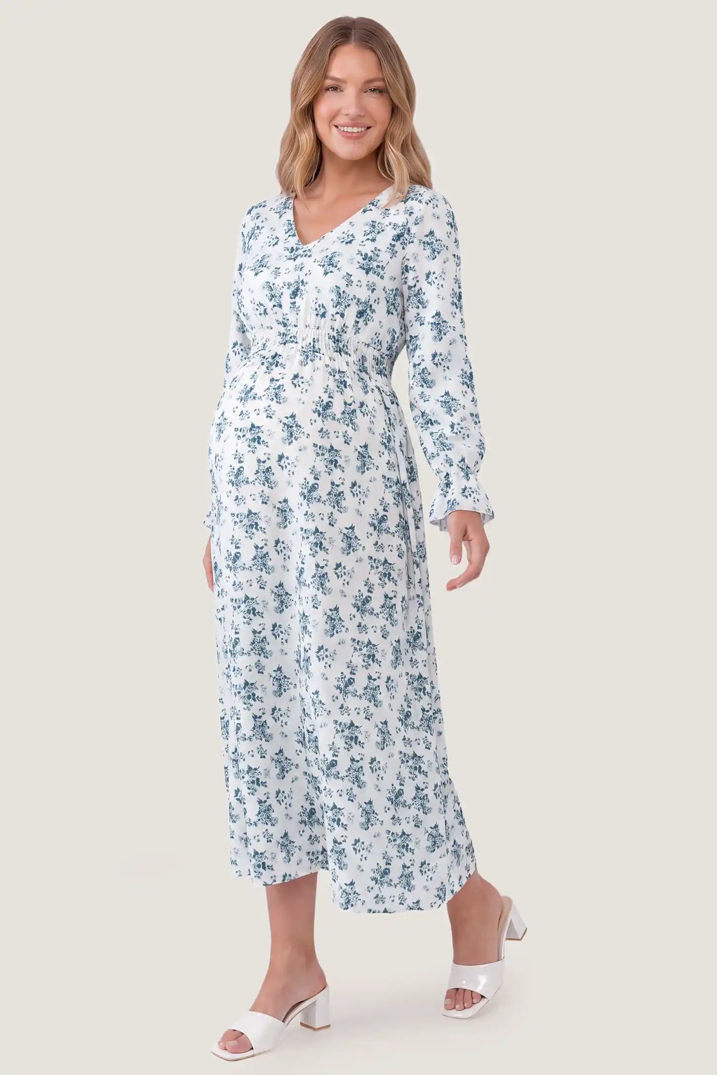 French Blue Floral V-Neck Maternity Dress French Blue Floral V-Neck Maternity Dress in French Blue Floral featuring a V-neckline, front view on a pregnant model.