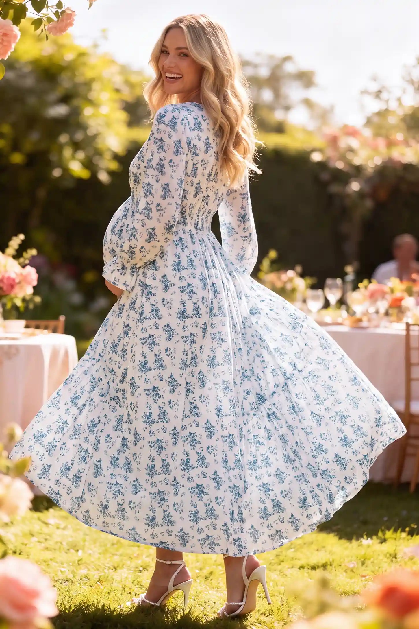 French Blue Floral V-Neck Maternity Dress French Blue Floral V-Neck Maternity Dress in French Blue Floral with vintage print, side lifestyle view on a pregnant model.