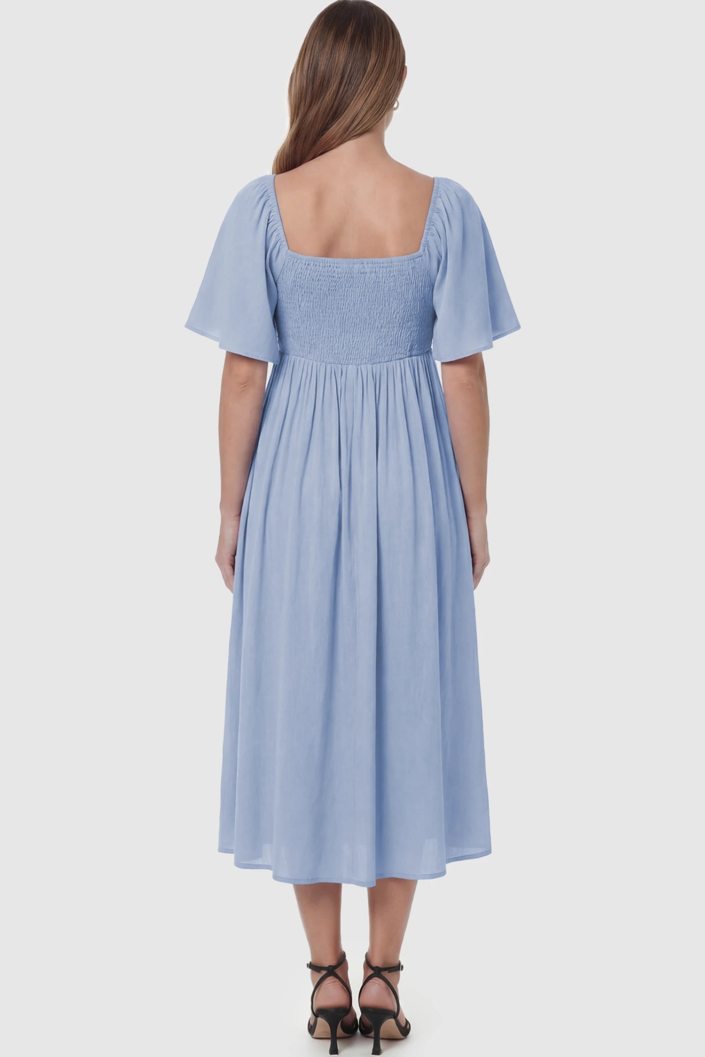 Front Tie Flutter Sleeve Maternity Midi Dress Front Tie Flutter Sleeve Maternity Midi Dress in light blue featuring a knotted V-neckline and flowy skirt on a pregnant model showing back.