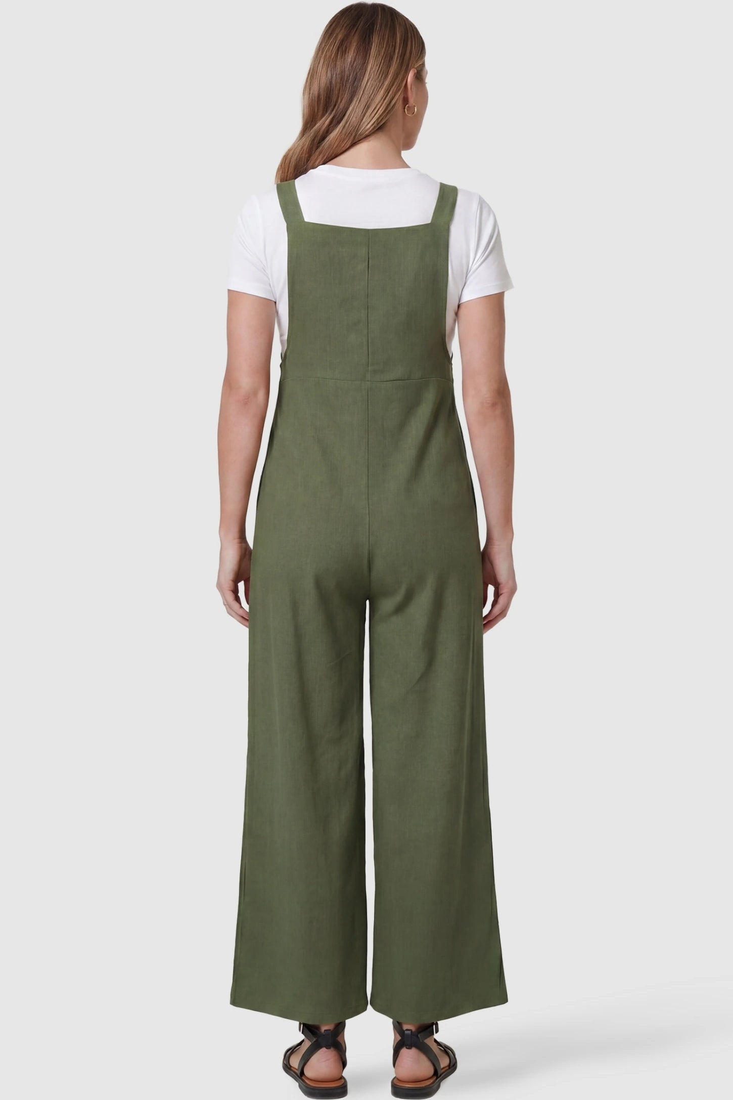 Full-Length Pocketed Maternity Jumpsuit Full-Length Pocketed Maternity Jumpsuit in Army Green featuring a relaxed wide-leg cut on a pregnant model, back view.