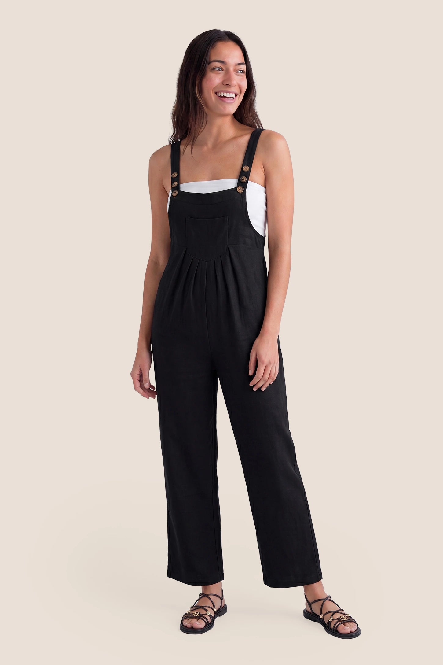 Full-Length Pocketed Maternity Jumpsuit Full-Length Pocketed Maternity Jumpsuit in Black featuring a relaxed wide-leg cut on a non-pregnant model, postpartum view.