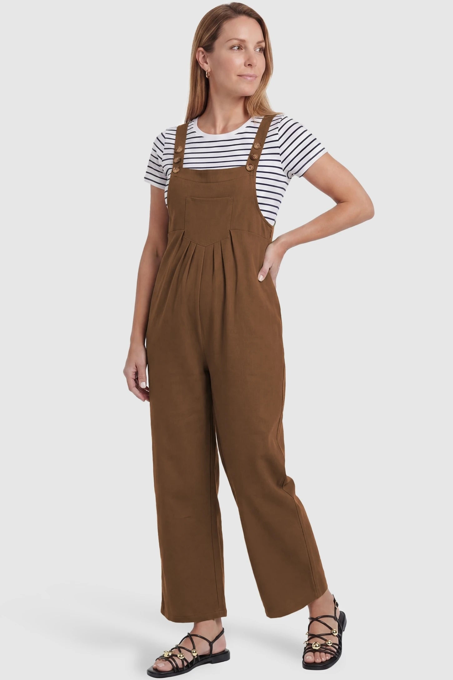 Full-Length Pocketed Maternity Jumpsuit Full-Length Pocketed Maternity Jumpsuit in Camel featuring a relaxed wide-leg cut on a non-pregnant model, postpartum view.