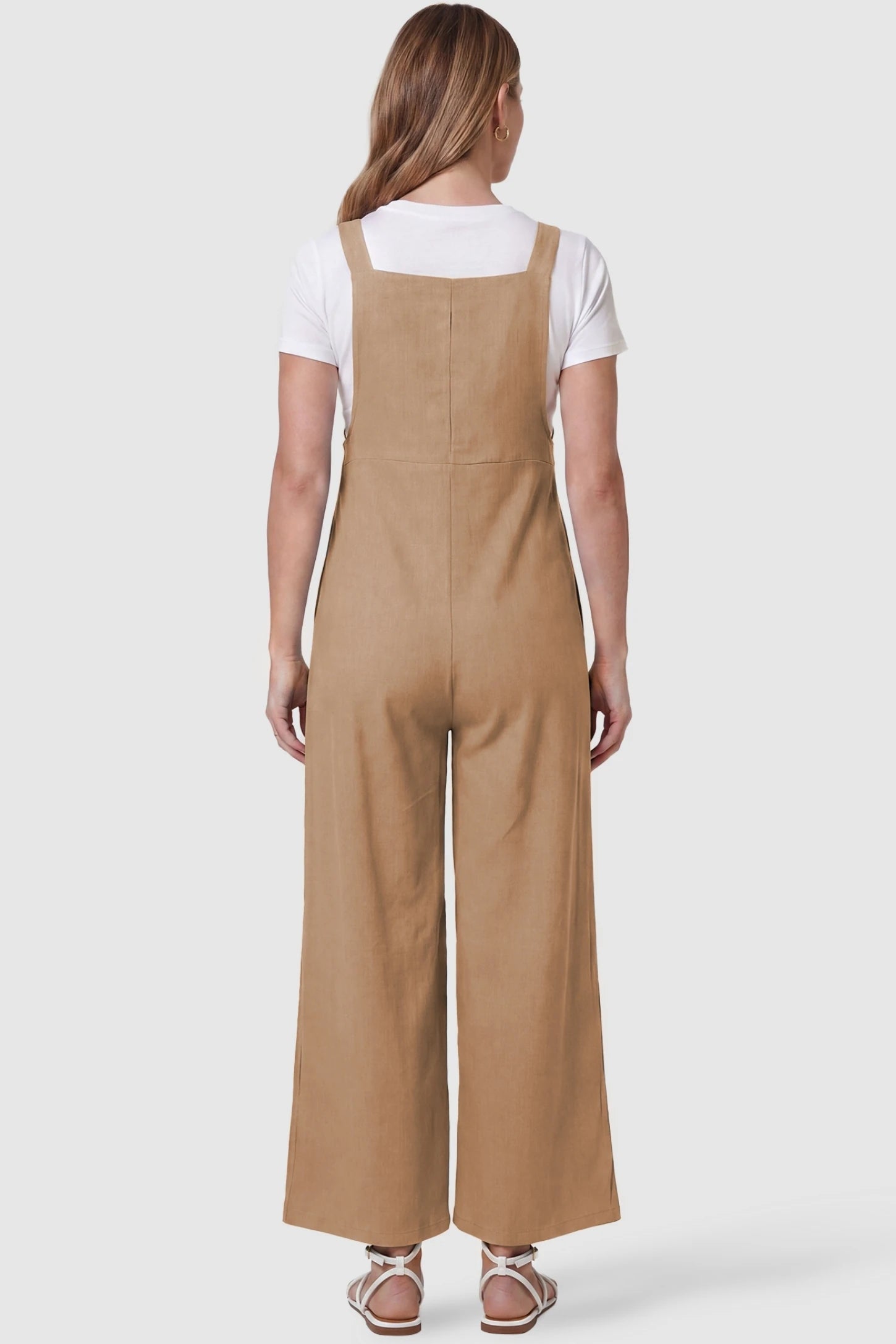 Full-Length Pocketed Maternity Jumpsuit Full-Length Pocketed Maternity Jumpsuit in Khaki featuring a relaxed wide-leg cut on a pregnant model, back view.