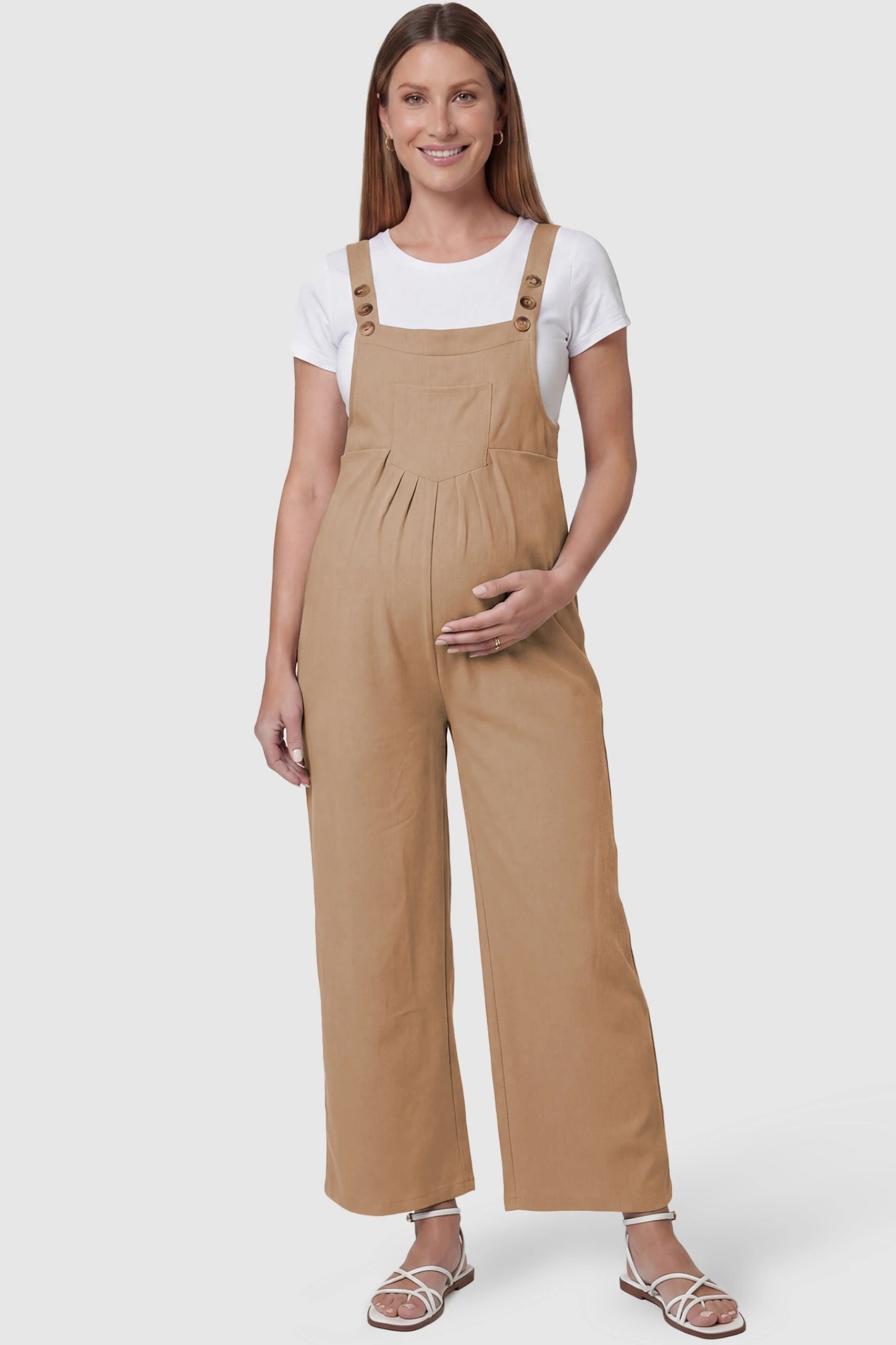 Full-Length Pocketed Maternity Jumpsuit Full-Length Pocketed Maternity Jumpsuit in Khaki featuring a relaxed wide-leg cut on a pregnant model, front view.