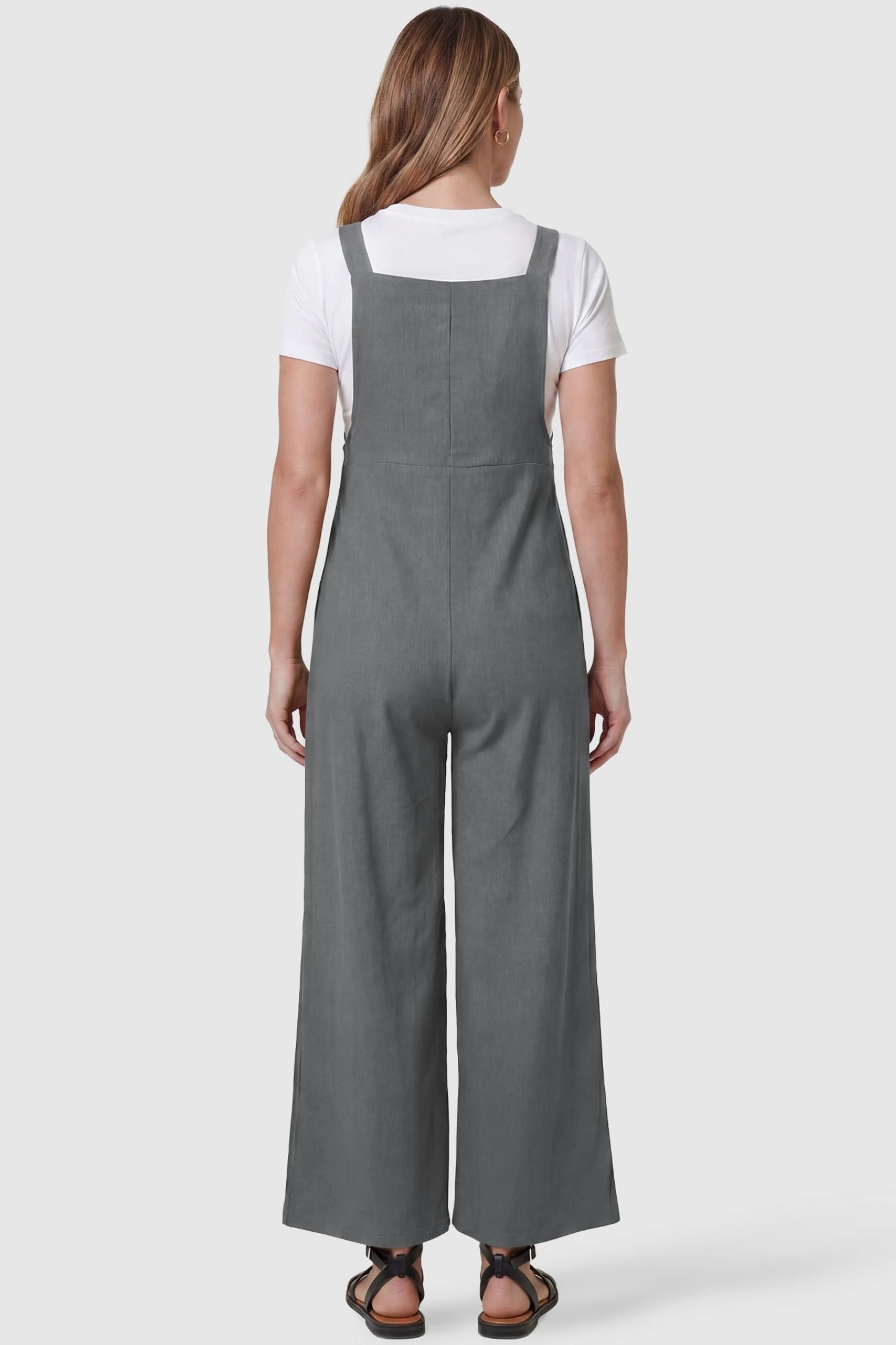 Full-Length Pocketed Maternity Jumpsuit Full-Length Pocketed Maternity Jumpsuit in Light Gray featuring a relaxed wide-leg cut on a pregnant model, back view.