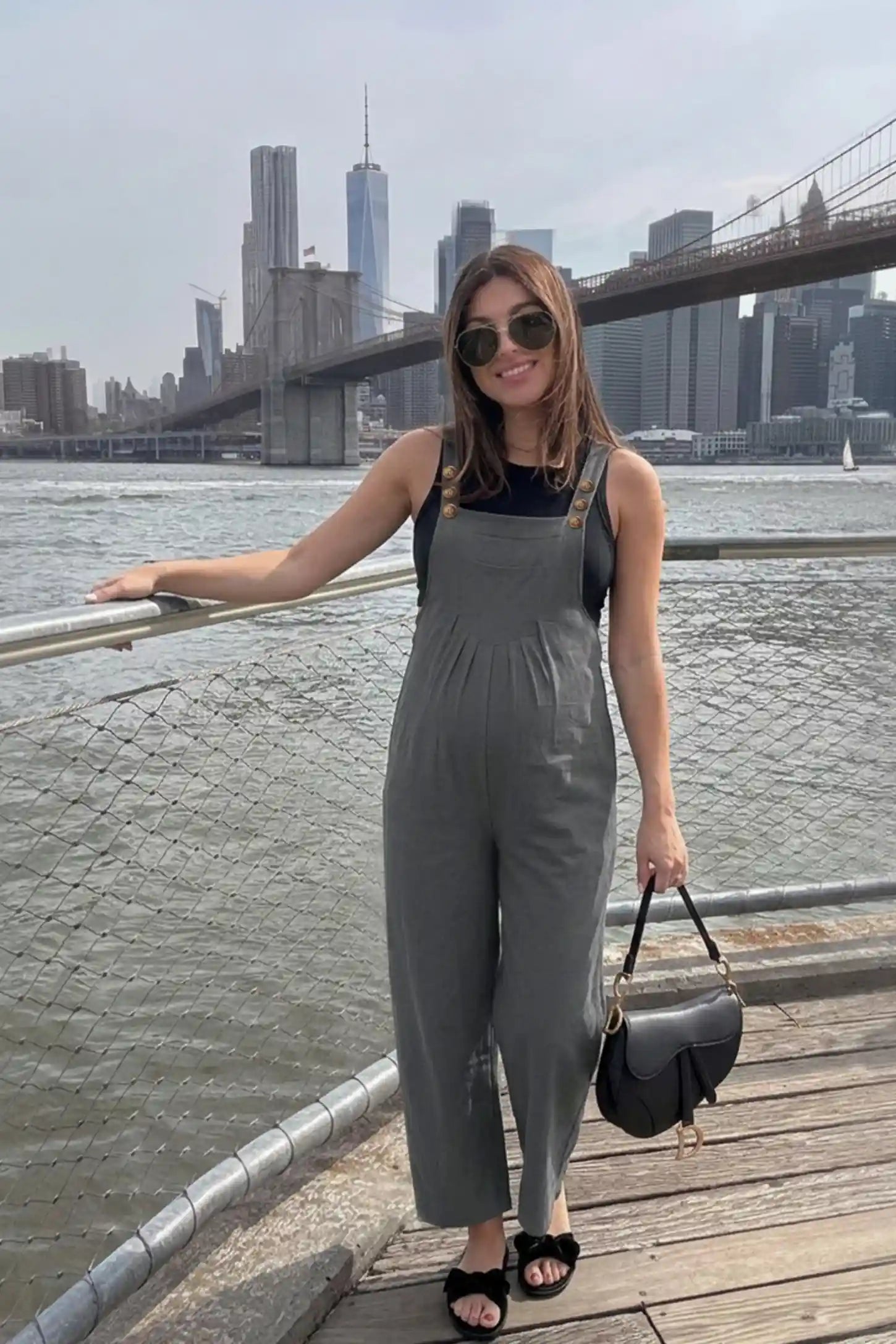 Full-Length Pocketed Maternity Jumpsuit Full-Length Pocketed Maternity Jumpsuit in Light Gray featuring a relaxed wide-leg cut on a pregnant model, editorial lifestyle view.