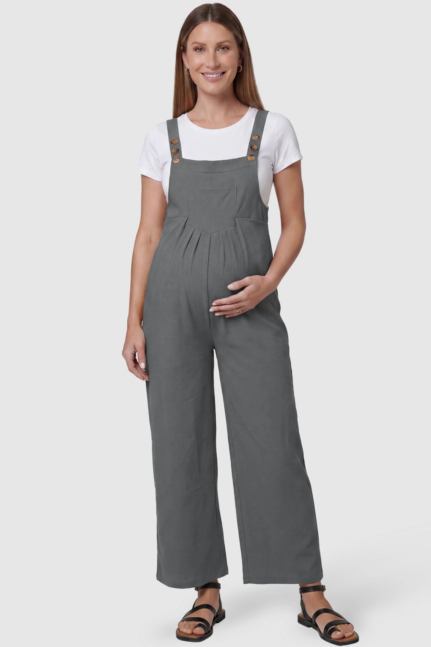 Full-Length Pocketed Maternity Jumpsuit Full-Length Pocketed Maternity Jumpsuit in Light Gray featuring a relaxed wide-leg cut on a pregnant model, front view.