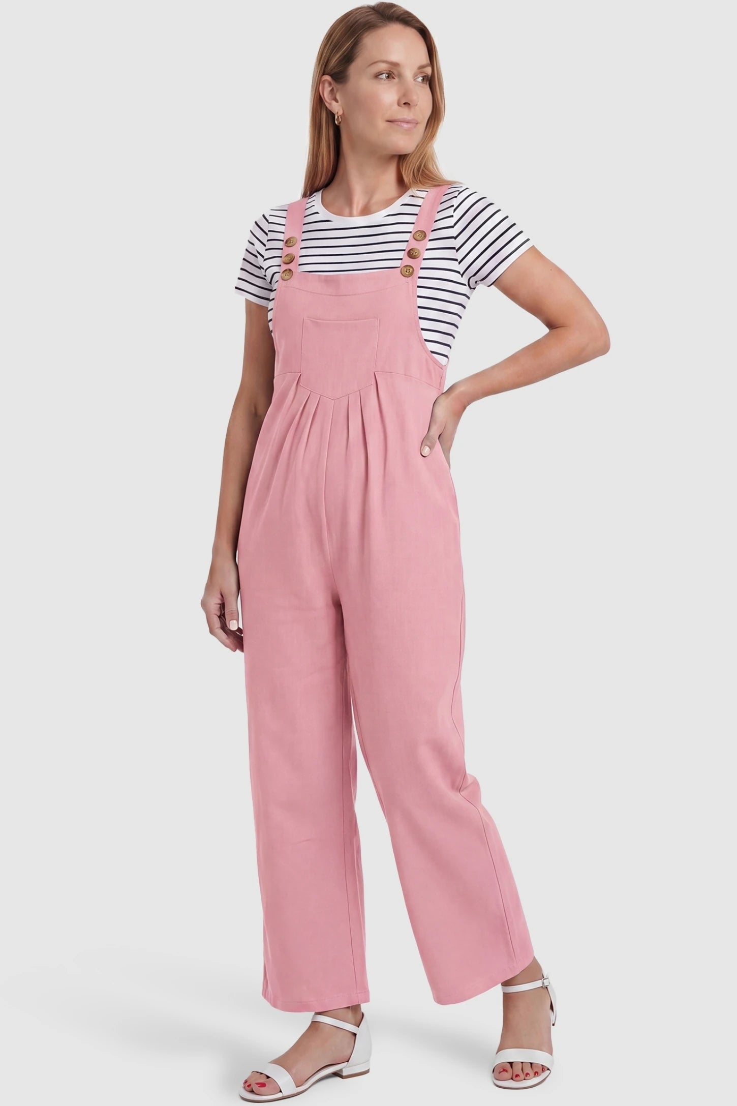Full-Length Pocketed Maternity Jumpsuit Full-Length Pocketed Maternity Jumpsuit in Pink featuring a relaxed wide-leg cut on a non-pregnant model, postpartum view.