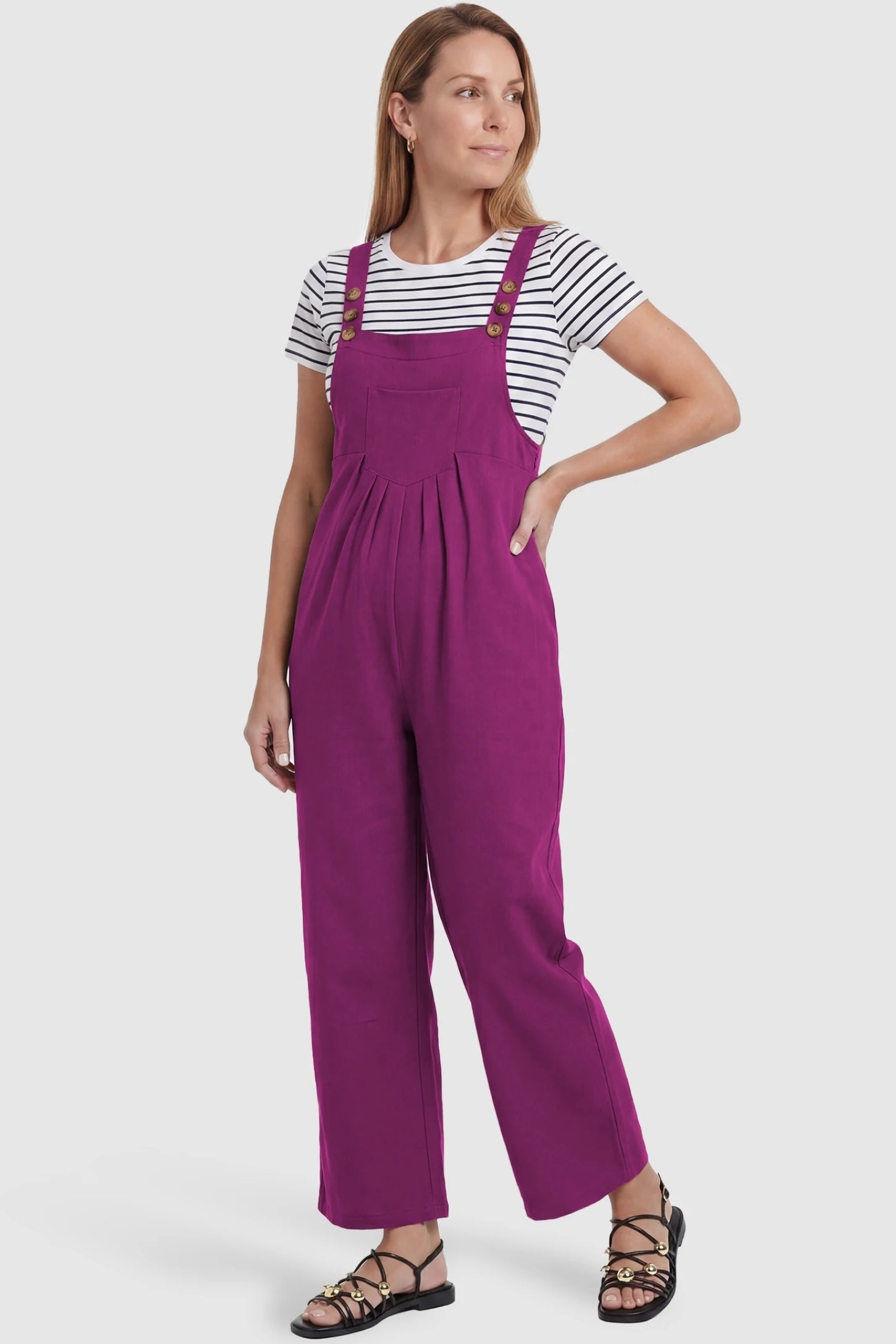 Full-Length Pocketed Maternity Jumpsuit Full-Length Pocketed Maternity Jumpsuit in Wine Red featuring a relaxed wide-leg cut on a non-pregnant model, postpartum view.