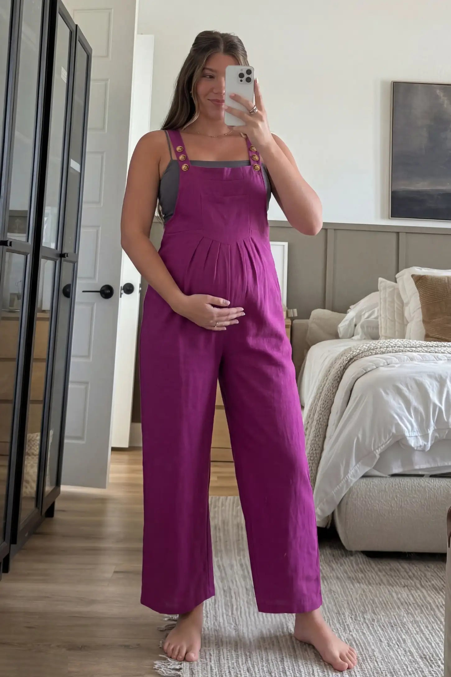 Full-Length Pocketed Maternity Jumpsuit Full-Length Pocketed Maternity Jumpsuit in Wine Red featuring a relaxed wide-leg cut on a pregnant model, ugc view.