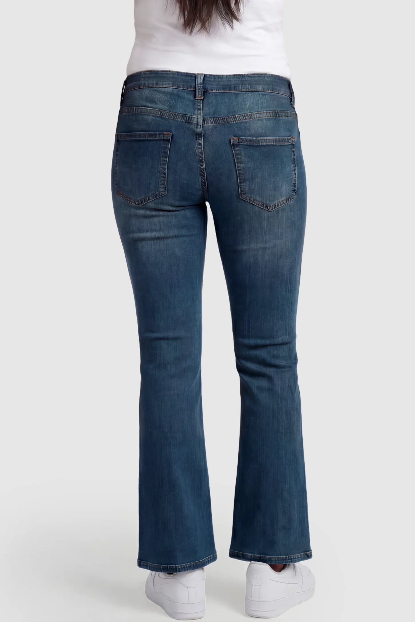 Full Panel Bootcut Maternity Jeans Full Panel Bootcut Maternity Jeans in medium wash blue featuring a stretchy over-the-belly panel on a pregnant model showing back.