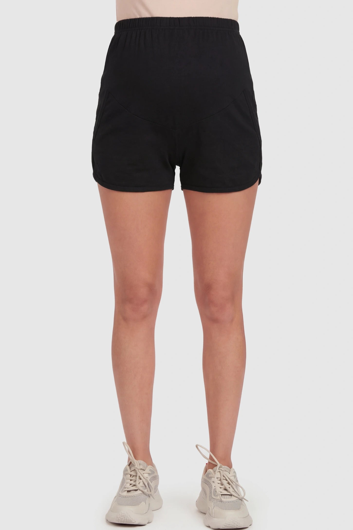 Full Panel Dolphin Hem Maternity Lounge Shorts Full Panel Maternity Lounge Shorts in Black featuring a dolphin hem on a pregnant model showing front.