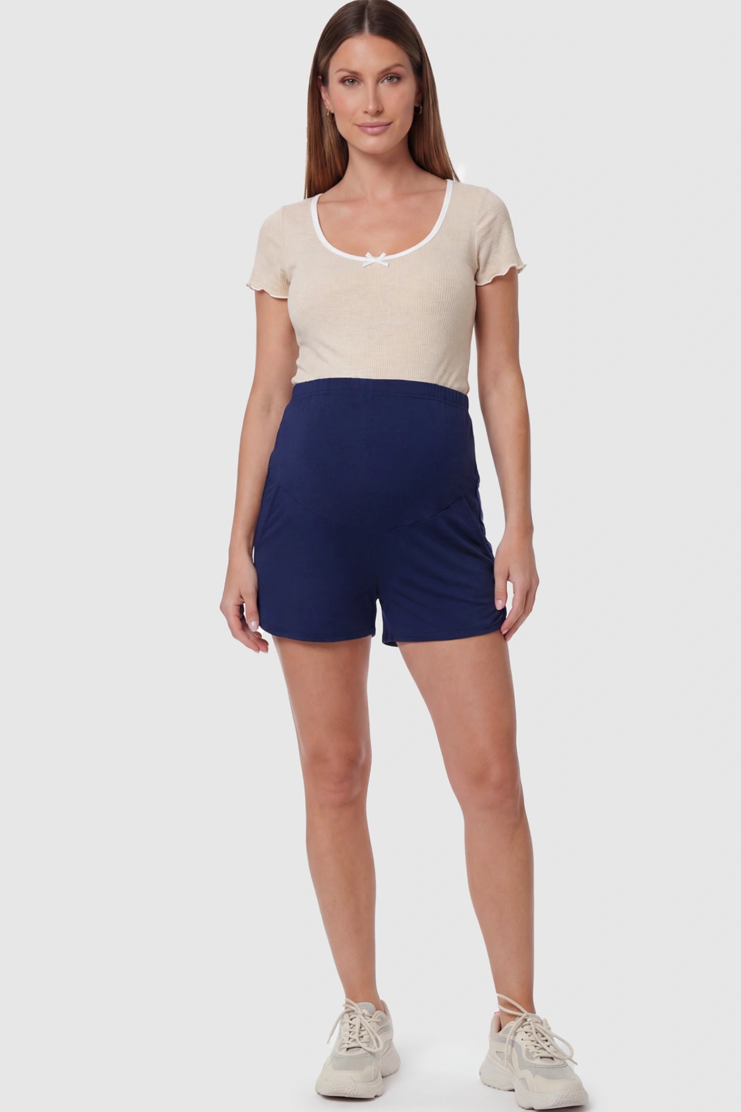 Full Panel Dolphin Hem Maternity Lounge Shorts Full Panel Maternity Lounge Shorts in Blue featuring a dolphin hem on a pregnant model showing full body.