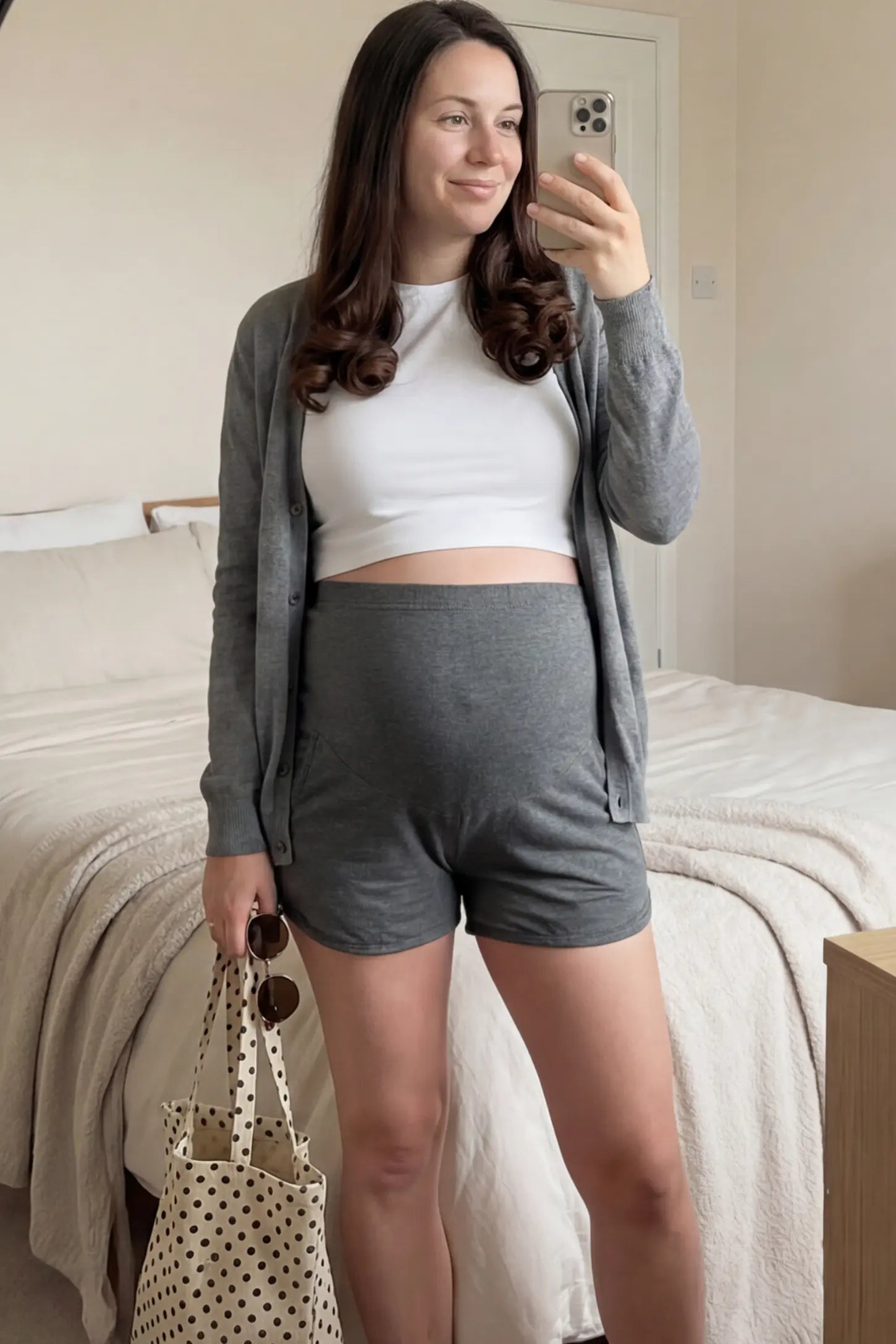 Full Panel Dolphin Hem Maternity Lounge Shorts Full Panel Maternity Lounge Shorts in Gray featuring a dolphin hem on a pregnant woman.