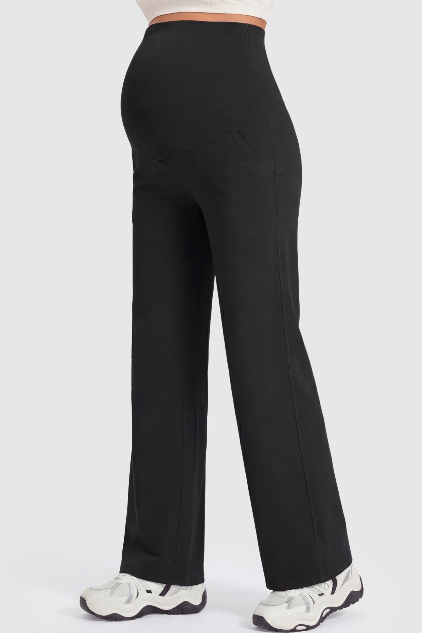 Full Panel High Waist Wide Leg Maternity Pants Full Panel High Waist Wide Leg Maternity Pants in Black featuring a supportive expansion-waist on a pregnant model showing side.