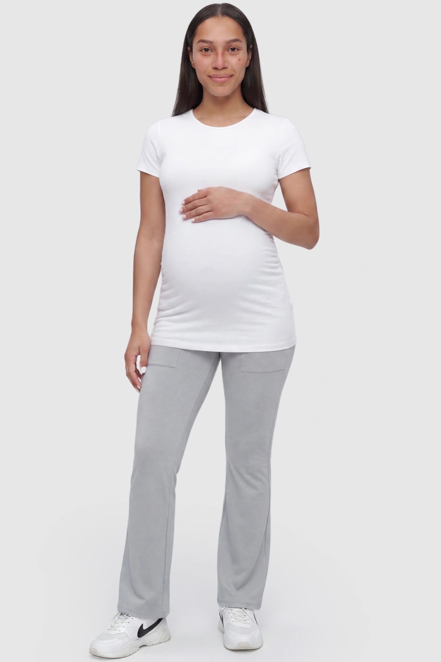 Full Panel Pocketed Flare Leg Maternity Leggings Full Panel Pocketed Flare Leg Maternity Leggings in Gray featuring a ribbed over-the-bump panel on a pregnant model, full body view.