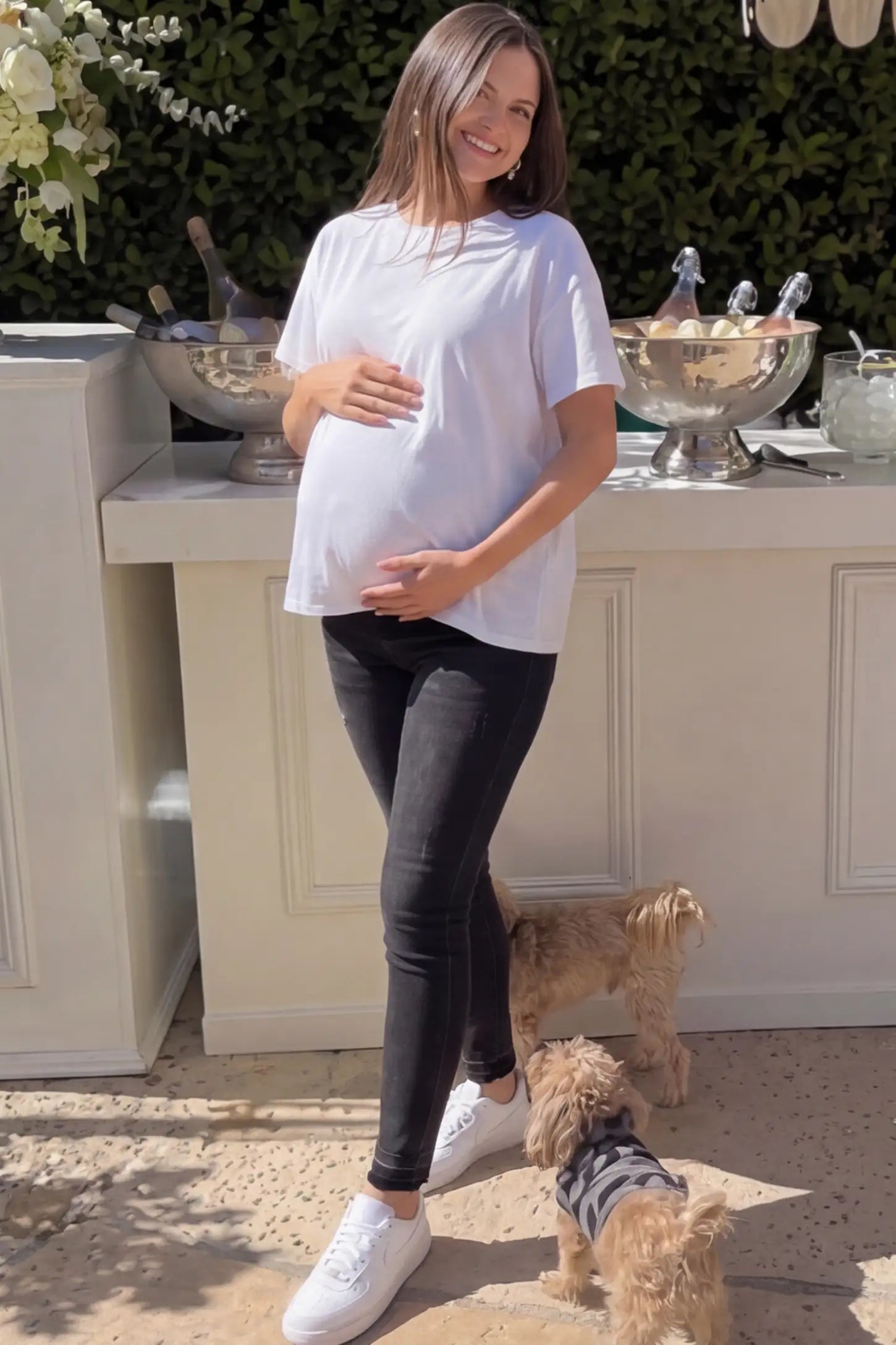 Full Panel Released Hem Maternity Skinny Jeans Full Panel Released Hem Maternity Skinny Jeans in Black featuring a released hem and over-the-belly panel on a pregnant woman.