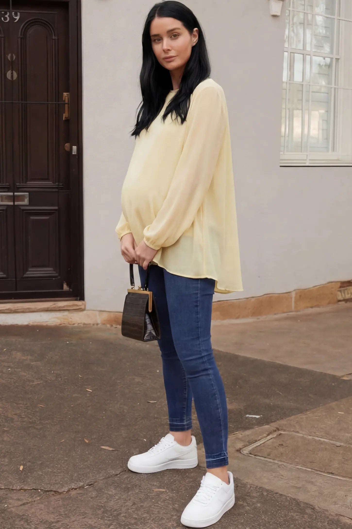 Full Panel Released Hem Maternity Skinny Jeans Full Panel Released Hem Maternity Skinny Jeans in dark blue featuring a released hem and over-the-belly panel on a pregnant woman.