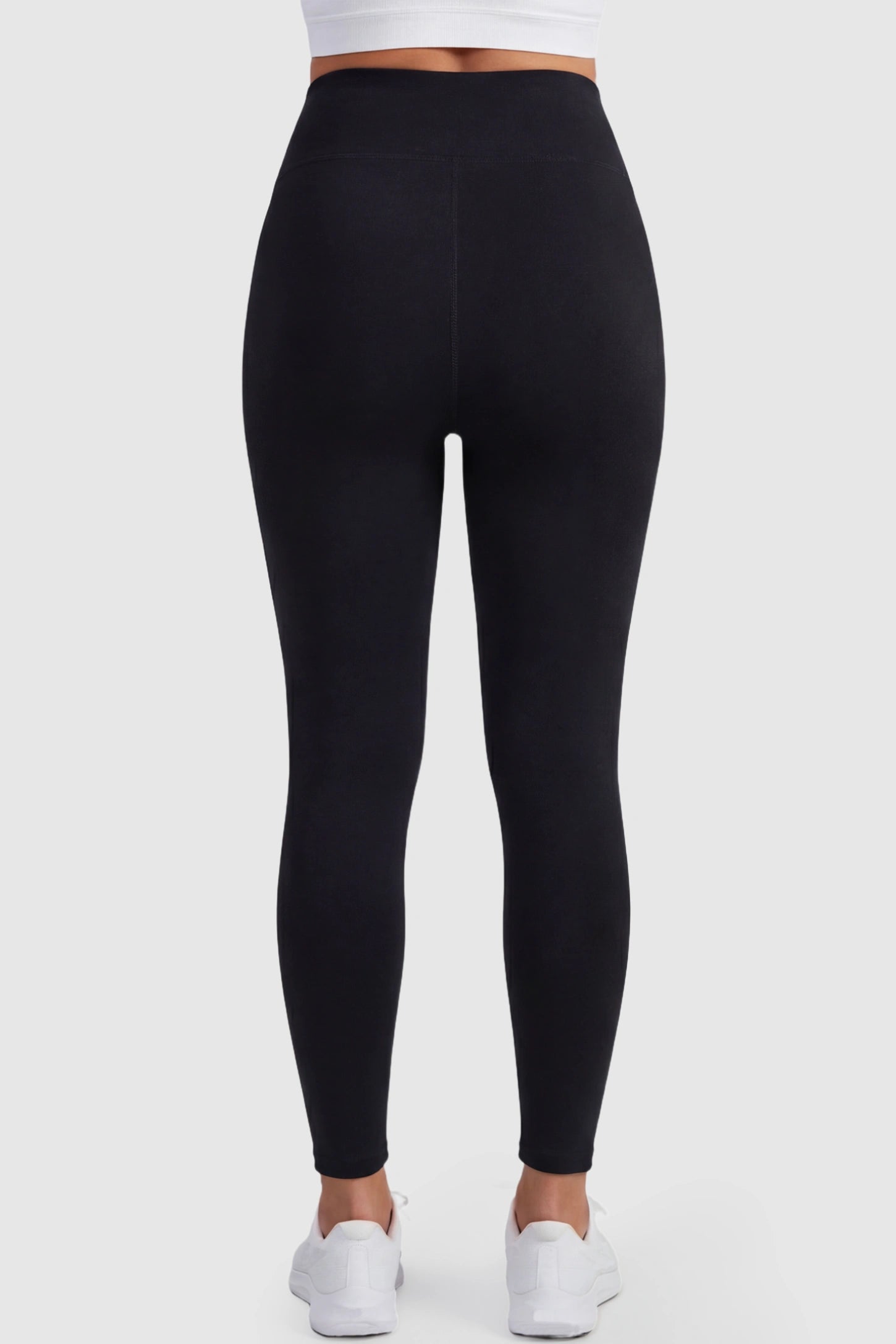 Full Panel Slim Fit Maternity Leggings Full Panel Slim Fit Maternity Leggings in Black featuring elastic and breathable fabric on a pregnant model, back view.
