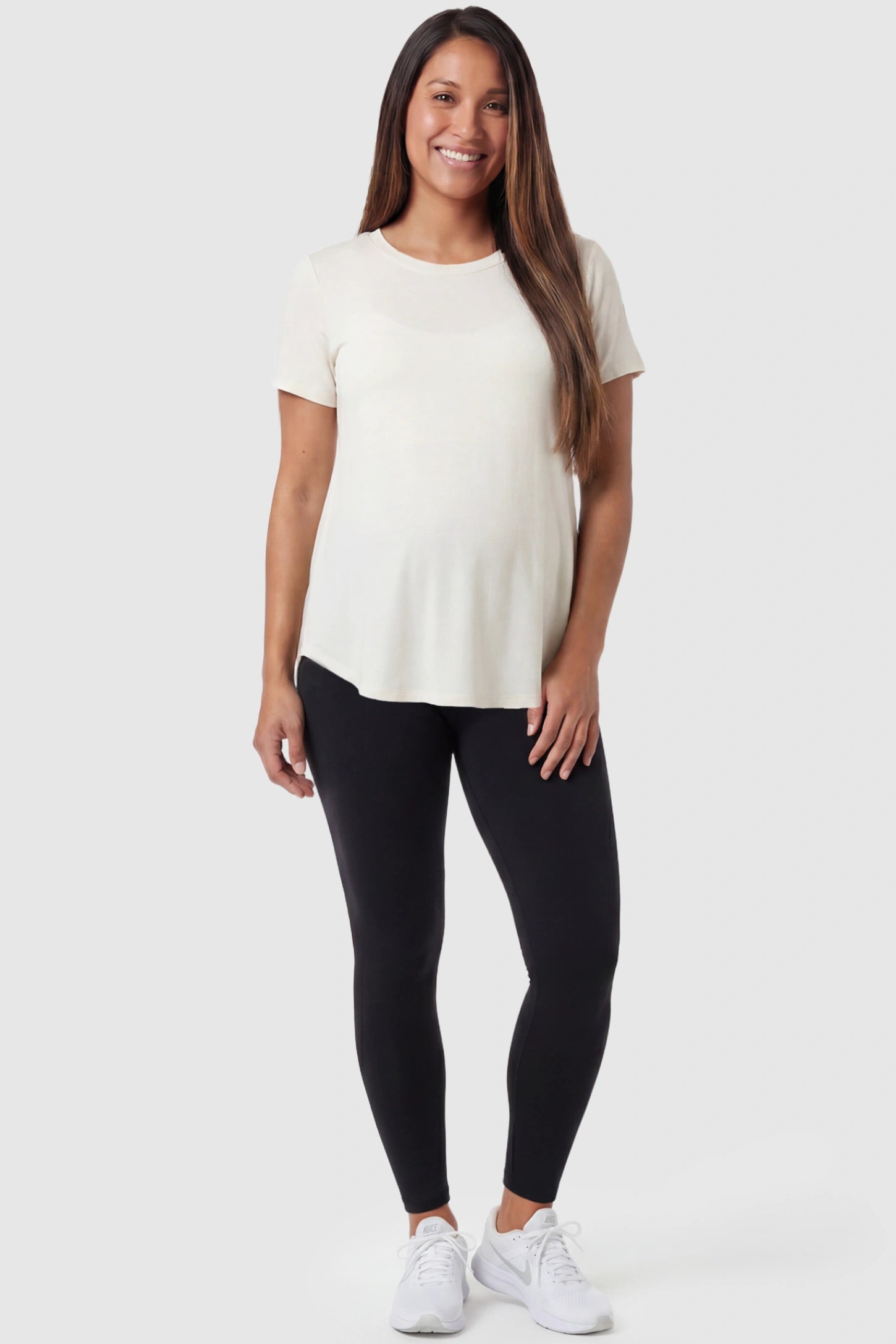 Full Panel Slim Fit Maternity Leggings Full Panel Slim Fit Maternity Leggings in Black featuring a seamless over-the-belly waistband on a postpartum model, front view.