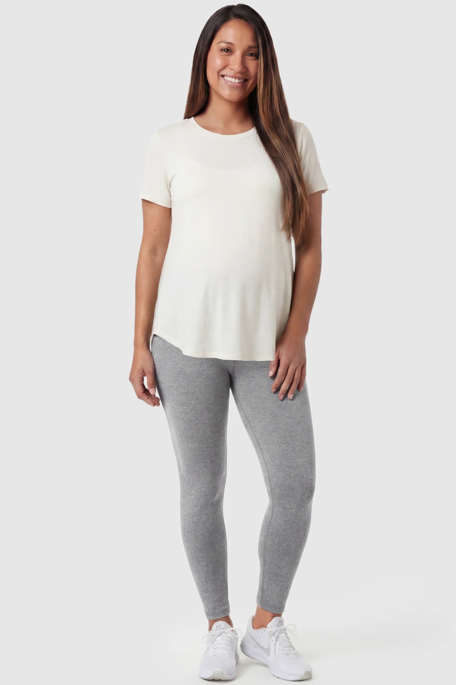 Full Panel Slim Fit Maternity Leggings Full Panel Slim Fit Maternity Leggings in Light Gray featuring a seamless over-the-belly waistband on a pregnant model, front view.