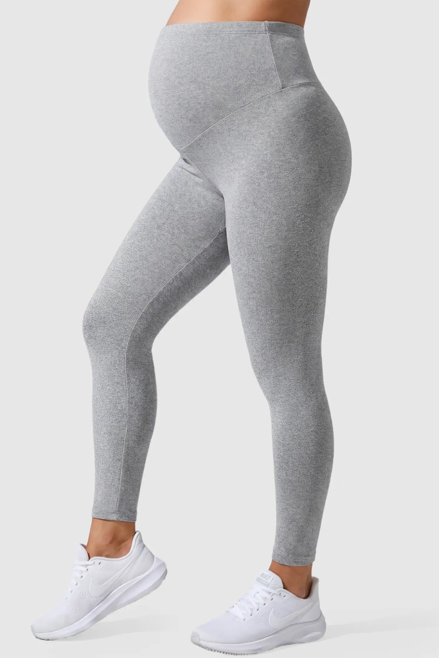 Full Panel Slim Fit Maternity Leggings Full Panel Slim Fit Maternity Leggings in Light Gray featuring a seamless over-the-belly waistband on a pregnant model, side view.