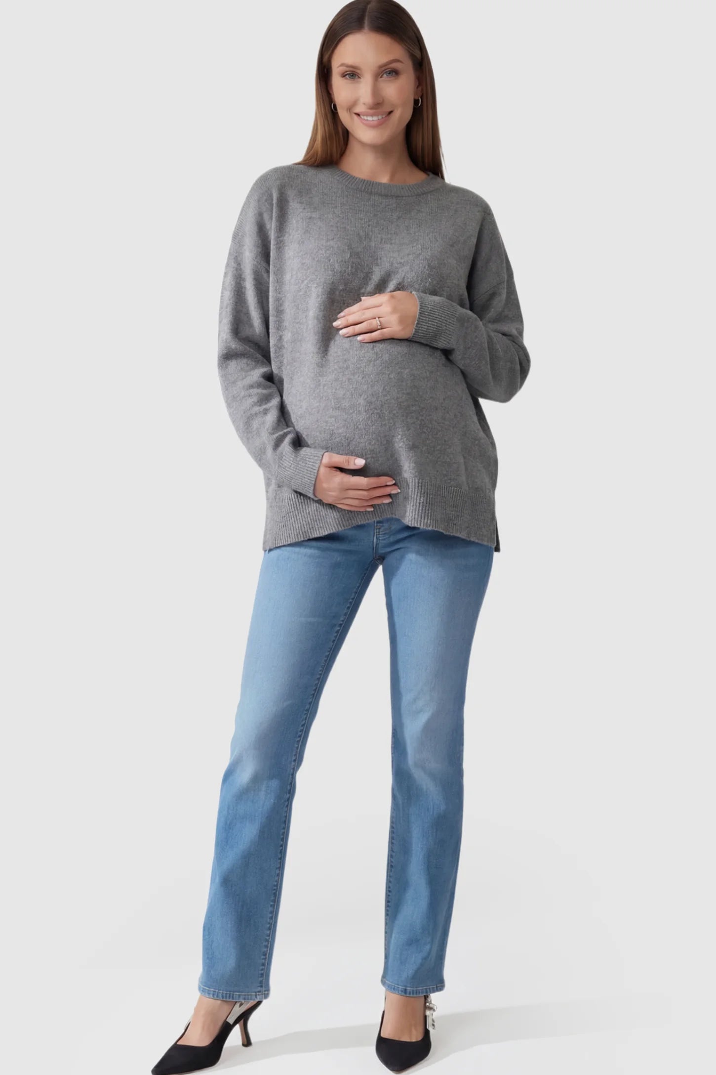 Full Panel Classic Straight Leg Maternity Jeans Full Panel Straight Leg Maternity Jeans in blue featuring a stretch support panel on a pregnant model facing front.