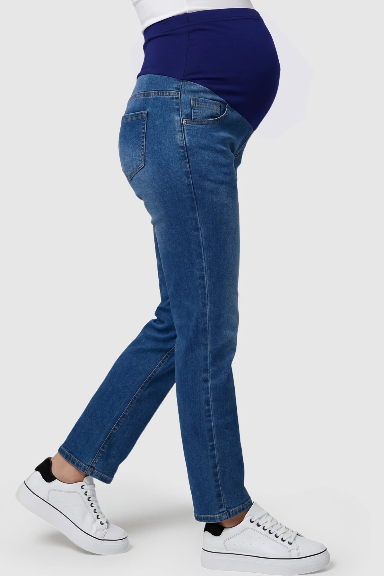 Full Panel Classic Straight Leg Maternity Jeans Full Panel Straight Leg Maternity Jeans in blue featuring a stretch support panel on a pregnant model side view.