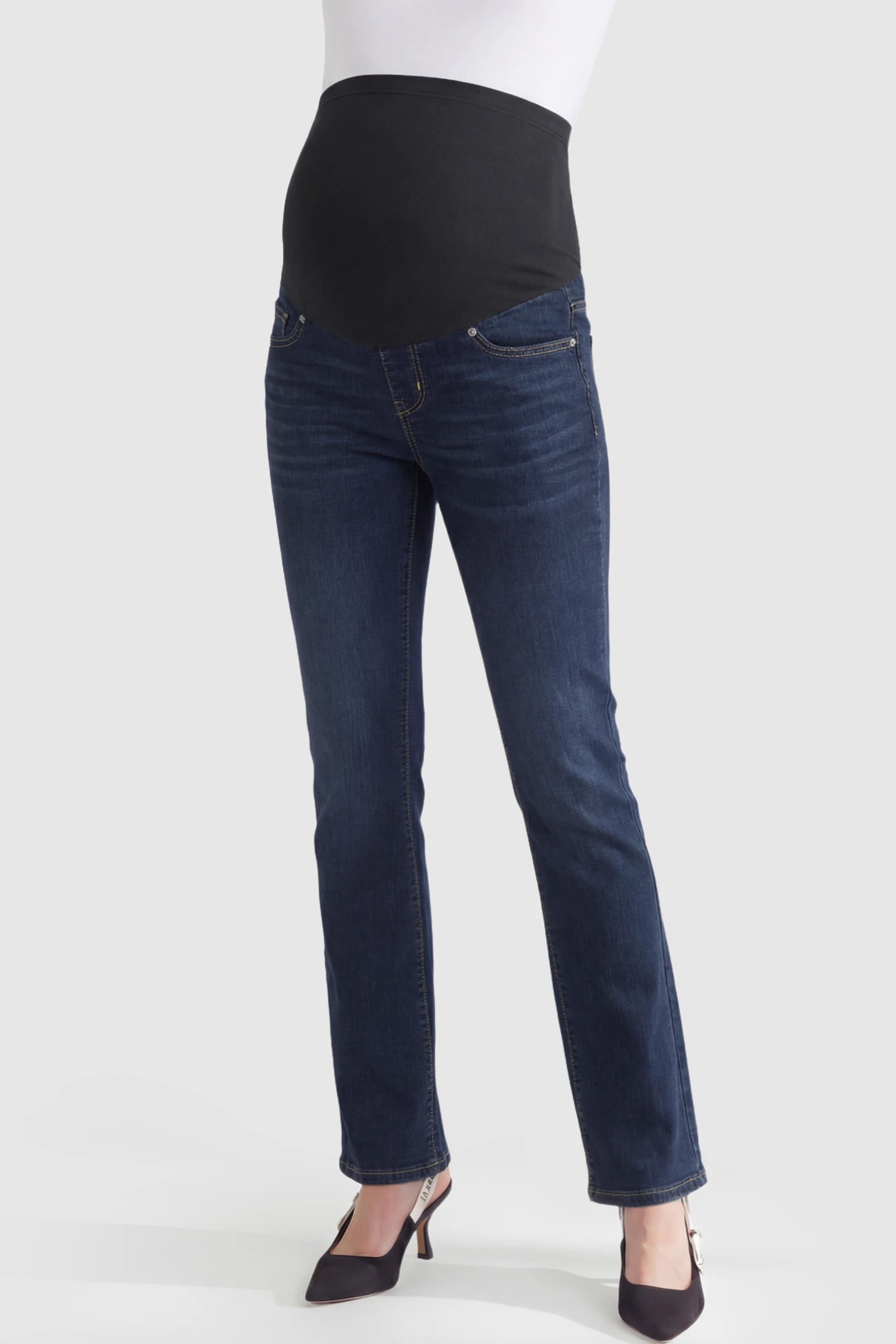 Full Panel Classic Straight Leg Maternity Jeans Full Panel Straight Leg Maternity Jeans in dark blue featuring a stretch support panel on a pregnant model showing front.