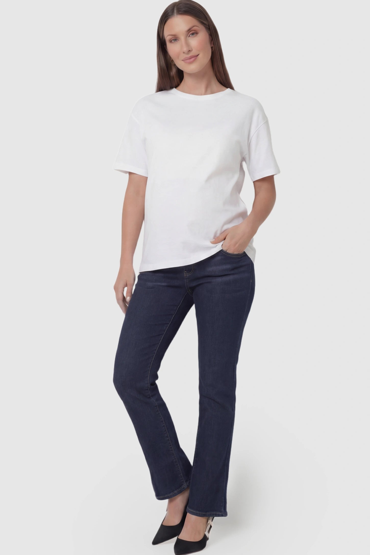 Full Panel Classic Straight Leg Maternity Jeans Full Panel Straight Leg Maternity Jeans in dark blue featuring a stretch support panel on a pregnant model facing front.