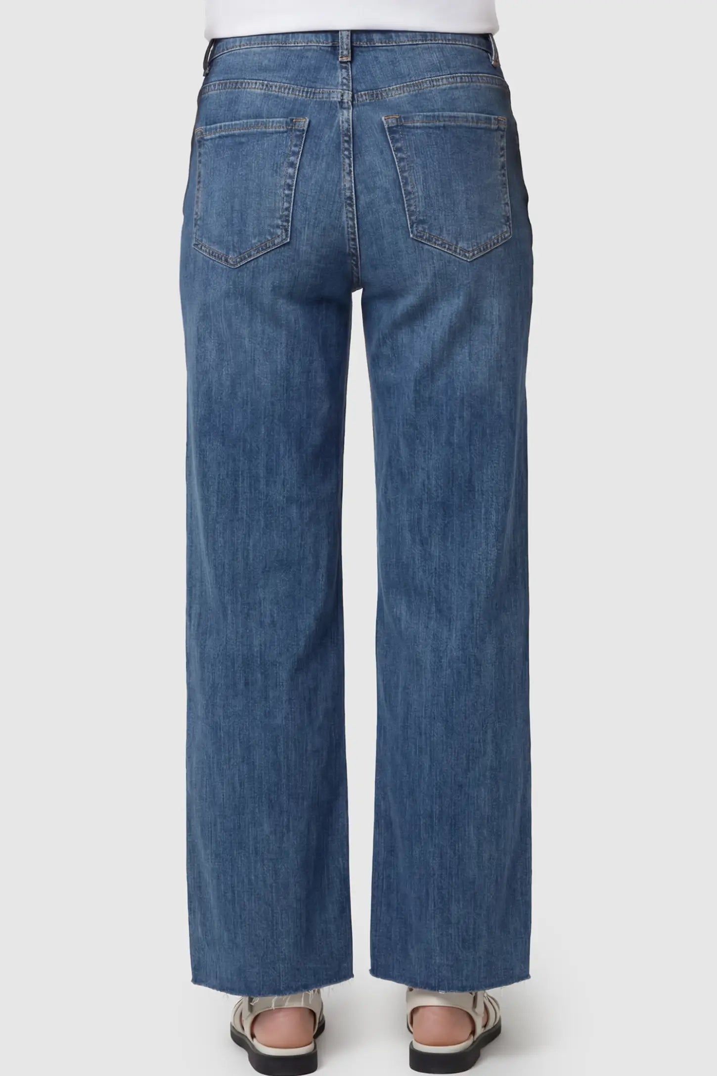 Full Panel Wide Leg Maternity Jeans Full Panel Wide Leg Maternity Jeans in Dark Blue featuring wide leg on a pregnant model showing back.