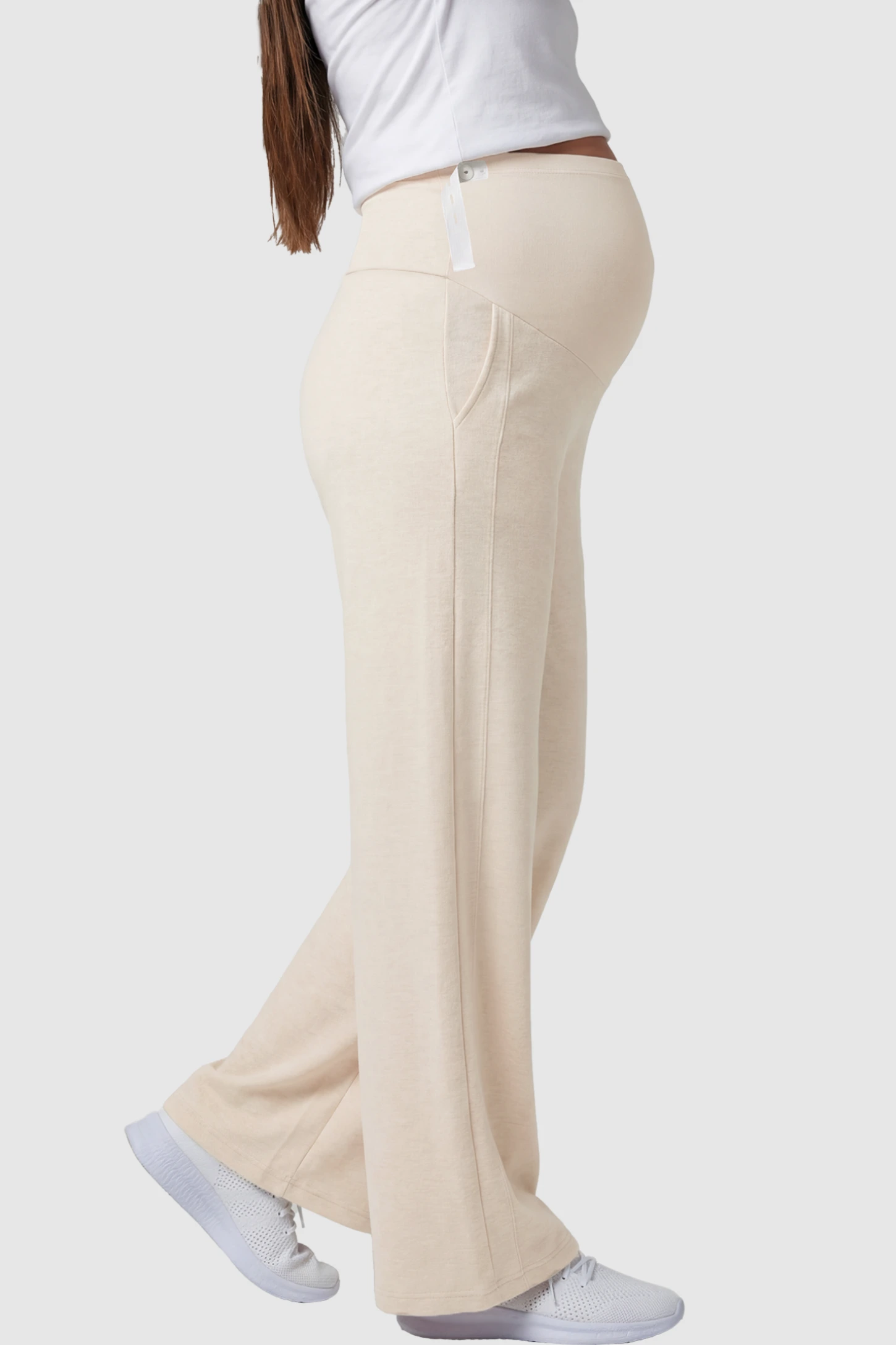 Full Panel Wide Leg Maternity Lounge Pants Full Panel Wide Leg Maternity Lounge Pants in beige featuring a high-stretch full belly panel and pockets on a pregnant model showing side.