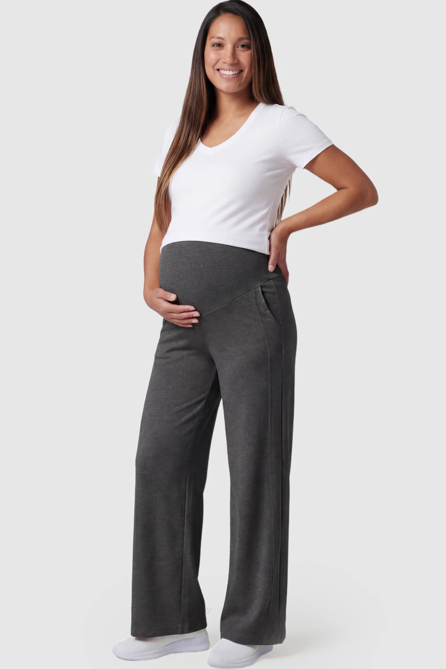 Full Panel Wide Leg Maternity Lounge Pants Full Panel Wide Leg Maternity Lounge Pants in Dark Gray featuring a high-stretch full belly panel and pockets on a pregnant model showing front.