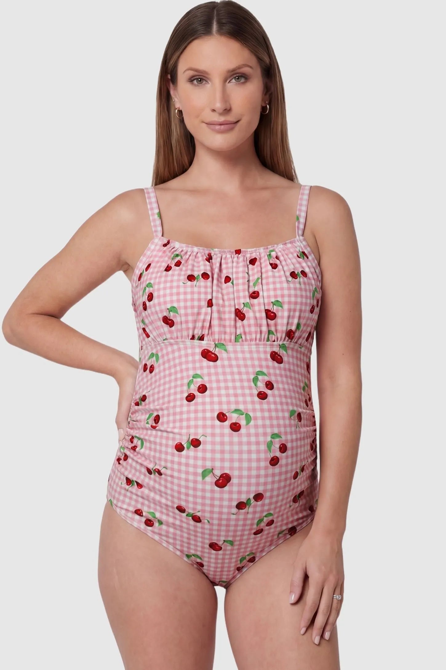 Gingham Matte Ruched Fit Maternity Swimsuit Gingham Matte Ruched Fit Maternity Swimsuit in pink featuring ruched detailing, front view on pregnant model.