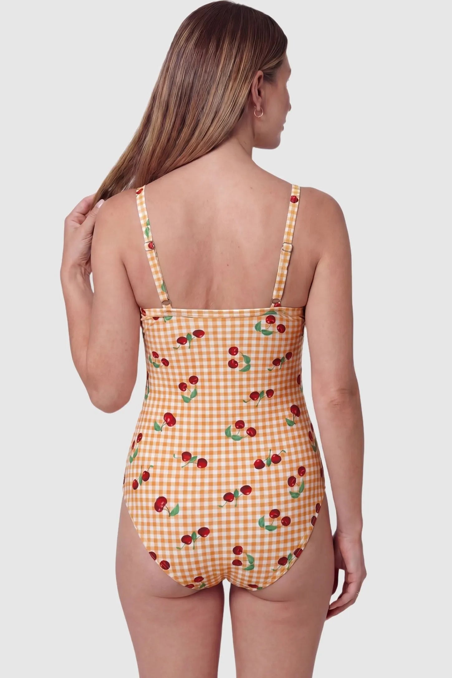 Gingham Matte Ruched Fit Maternity Swimsuit Gingham Matte Ruched Fit Maternity Swimsuit in yellow with adjustable shoulder straps, back view on pregnant model.