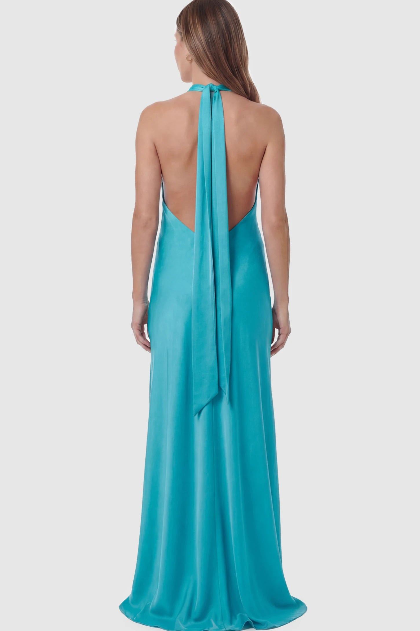 Solid Halter Neck Maternity Maxi Dress Solid Halter Neck Maternity Maxi Dress in Blue featuring a flowing skirt and backless design on a pregnant model showing back.