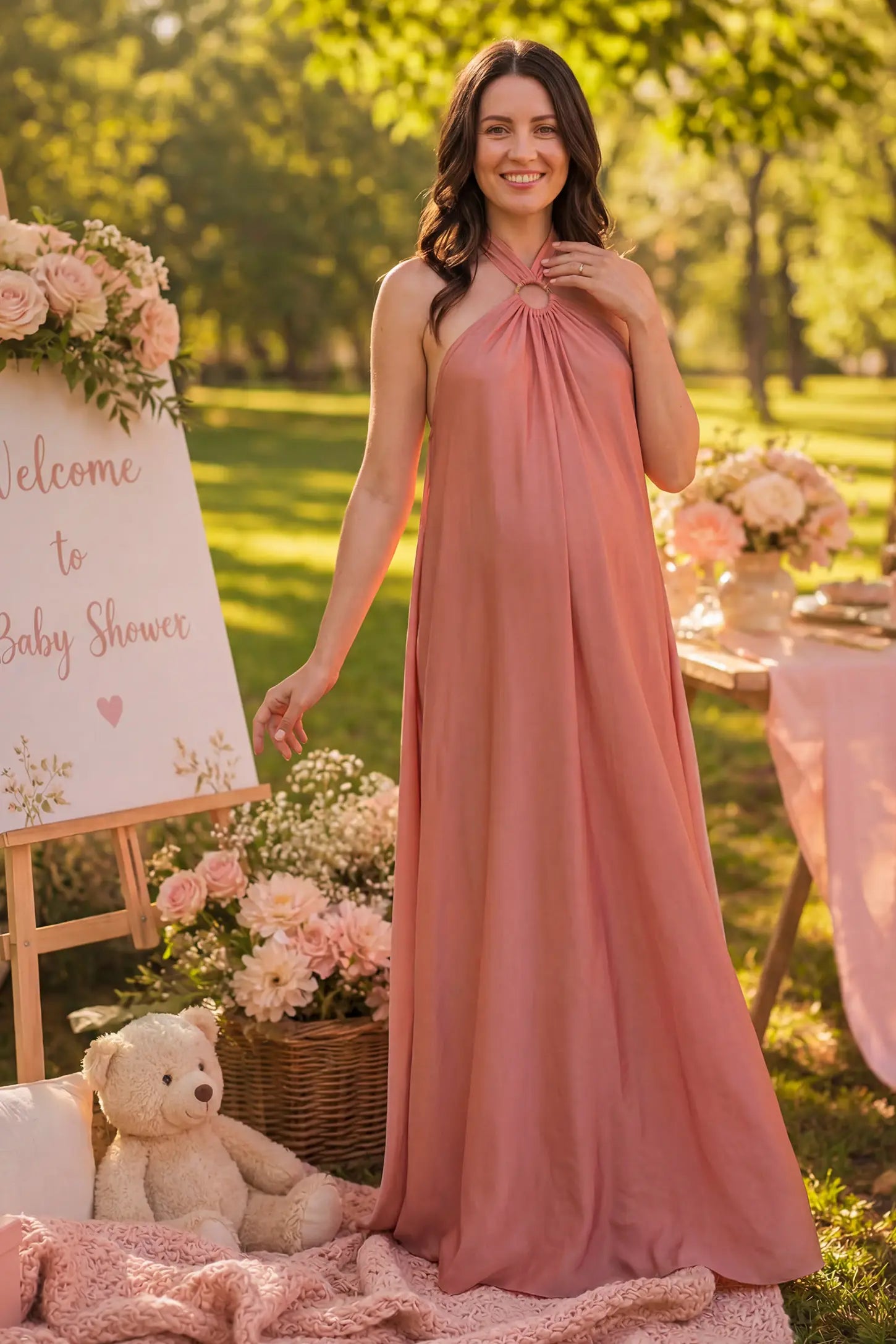 Solid Halter Neck Maternity Maxi Dress in Pink featuring a flowing skirt on a pregnant woman.