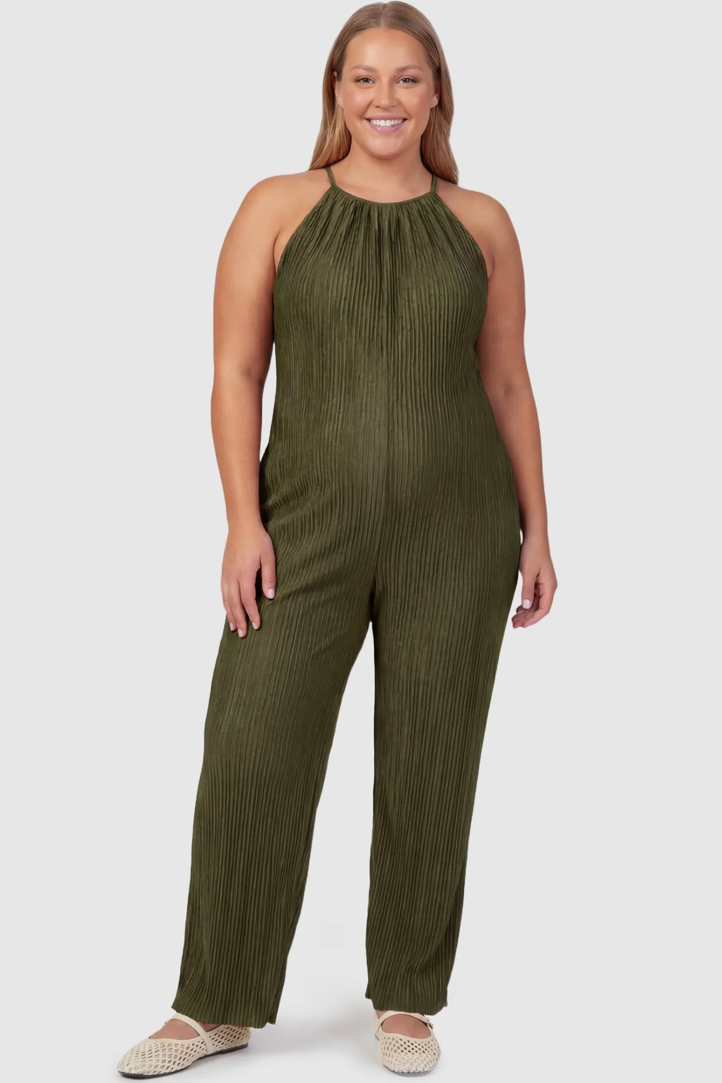 Halter Neck Wide Leg Pocketed Maternity Jumpsuit Halter Neck Wide Leg Pocketed Maternity Jumpsuit in Army Green featuring a gathered halter neck and ribbed texture on a plus-size pregnant model, front view.