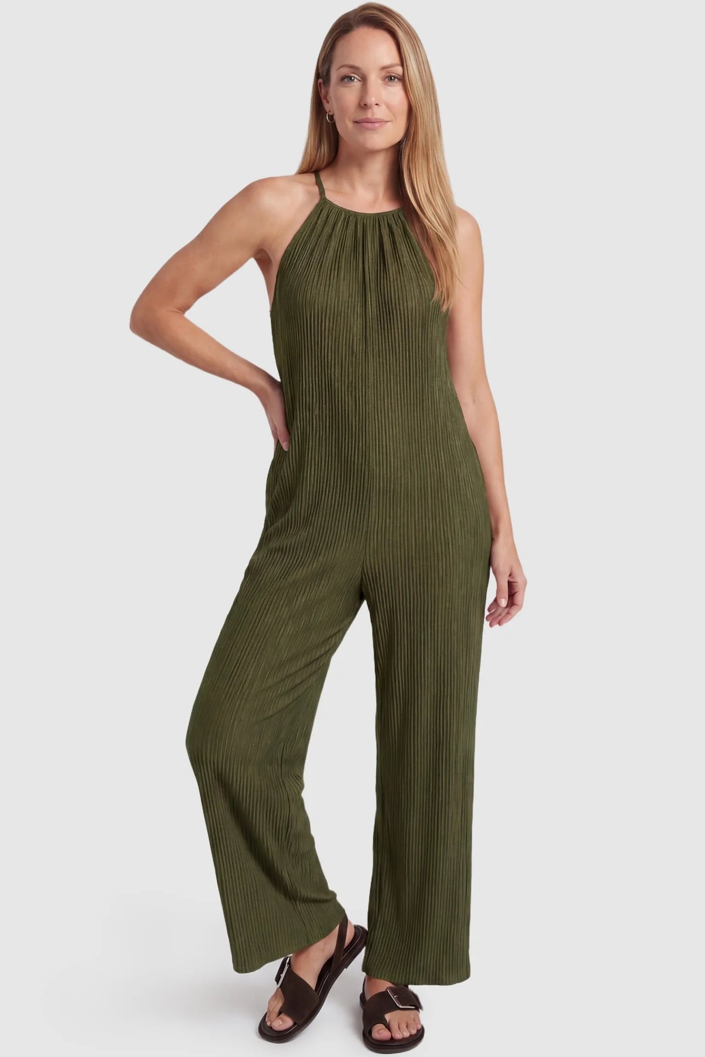 Halter Neck Wide Leg Pocketed Maternity Jumpsuit Halter Neck Wide Leg Pocketed Maternity Jumpsuit in Army Green featuring a halter neck and soft ribbing on a postpartum model, front view.
