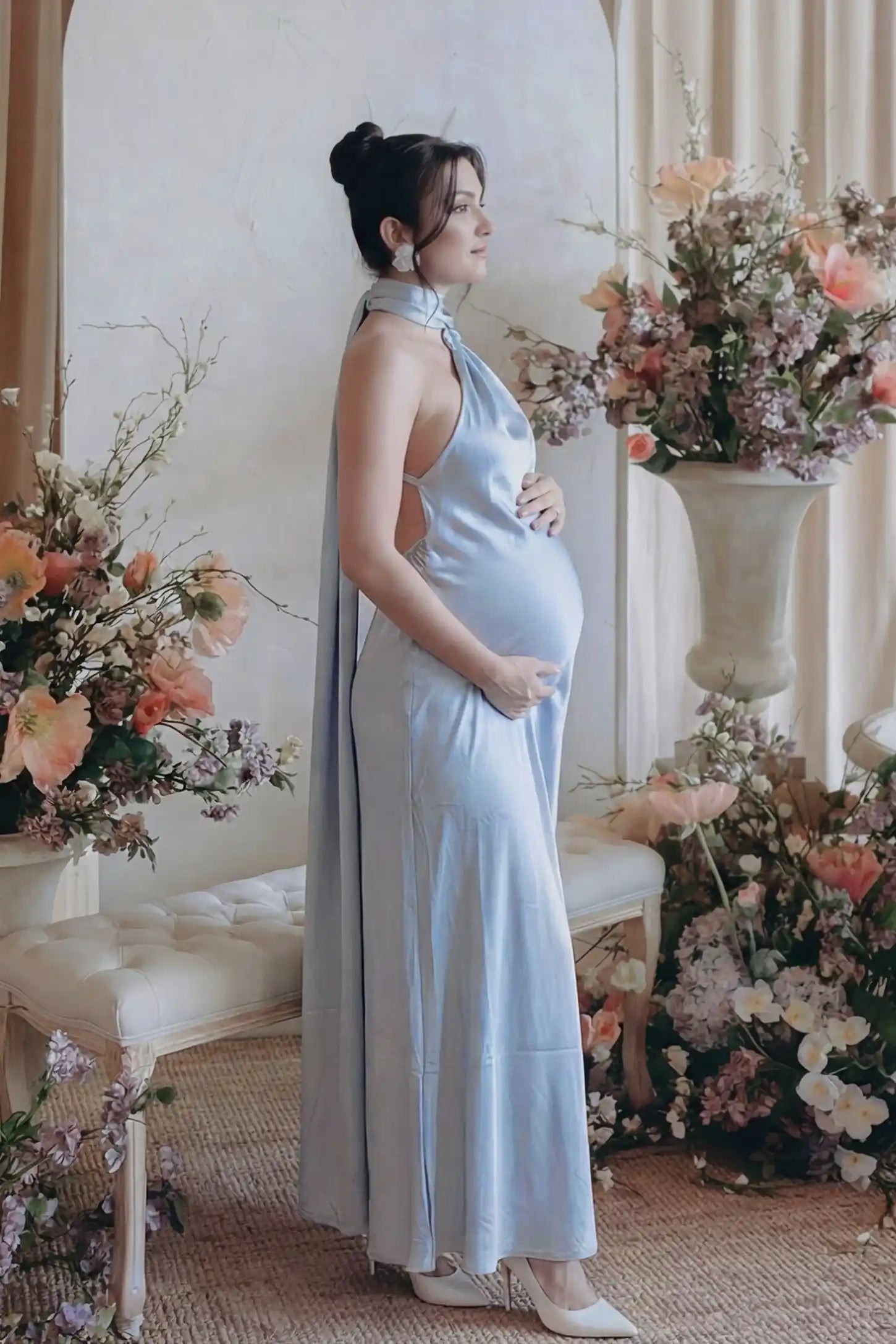 High-Shine Halter Sleeveless Maternity Maxi Dress High-Shine Halter Sleeveless Maternity Maxi Dress in Blue featuring a fluid silhouette on a pregnant model.