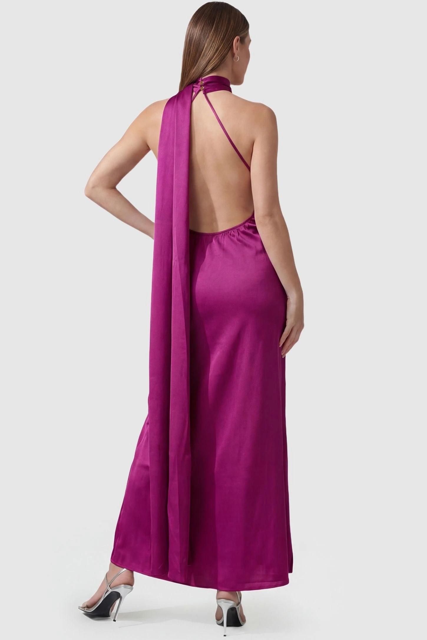 High-Shine Halter Sleeveless Maternity Maxi Dress High-Shine Halter Sleeveless Maternity Maxi Dress in Pink featuring a dramatic long neck-tie on a pregnant model, back view.