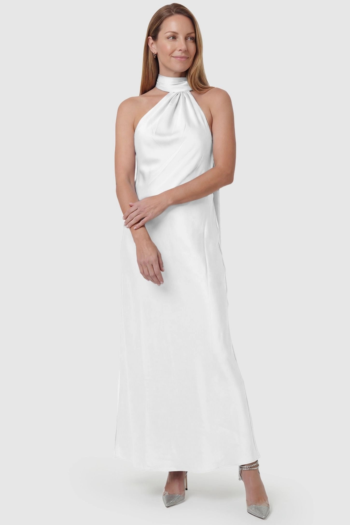 High-Shine Halter Sleeveless Maternity Maxi Dress High-Shine Halter Sleeveless Maternity Maxi Dress in White featuring an adaptable bodice on a non-pregnant model, front view.